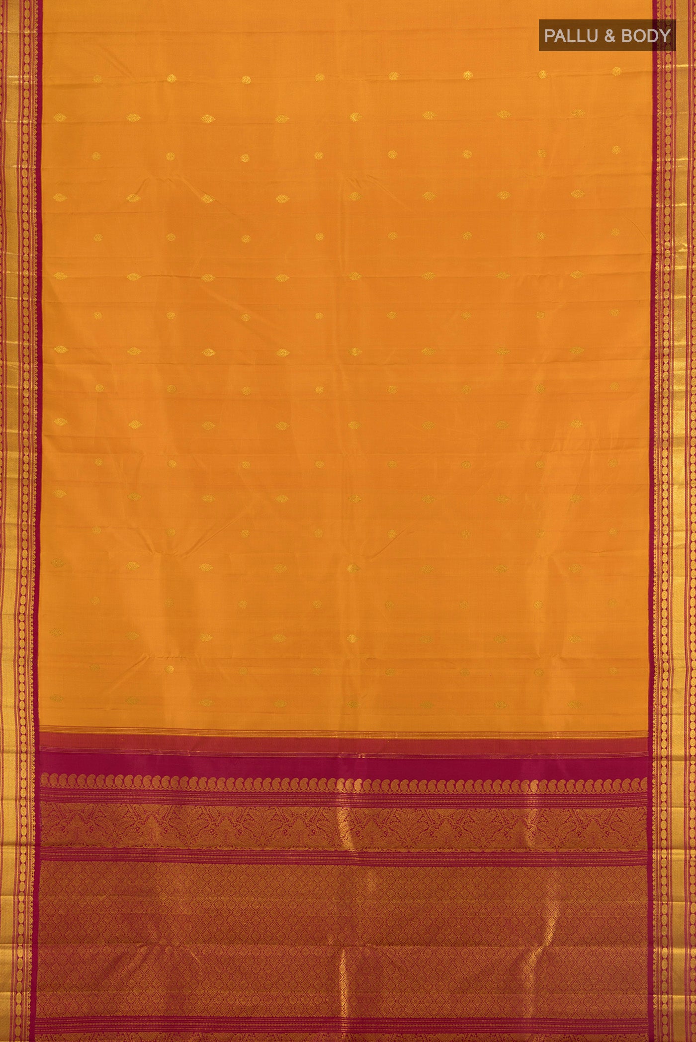 Flat view of Mustard Kanchipuram Silk Saree with Zari Butta on the body and Zari Border. 