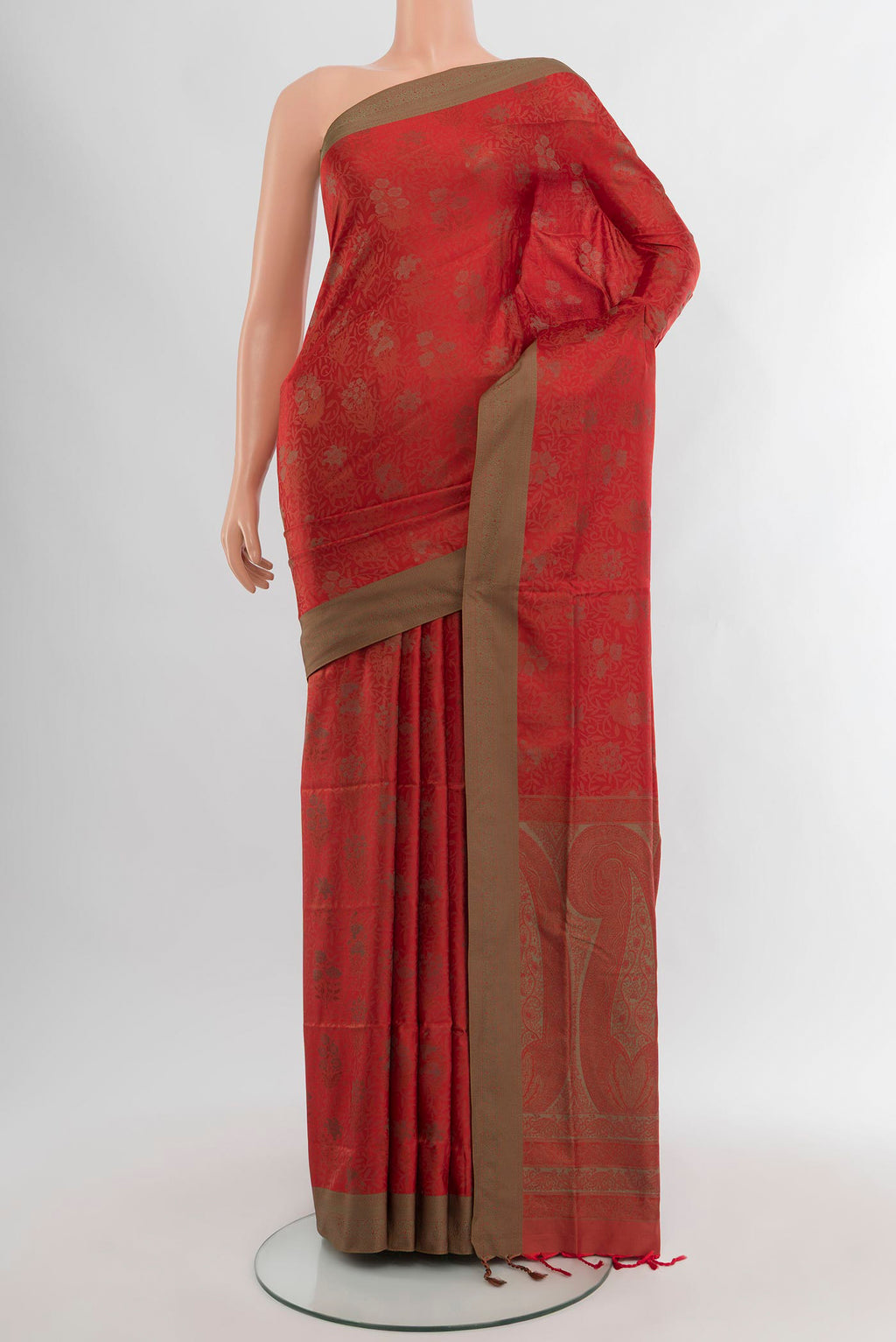 Rust Soft Silk Saree with Jacquard design on the body and Thread Border.  displayed on a mannequin