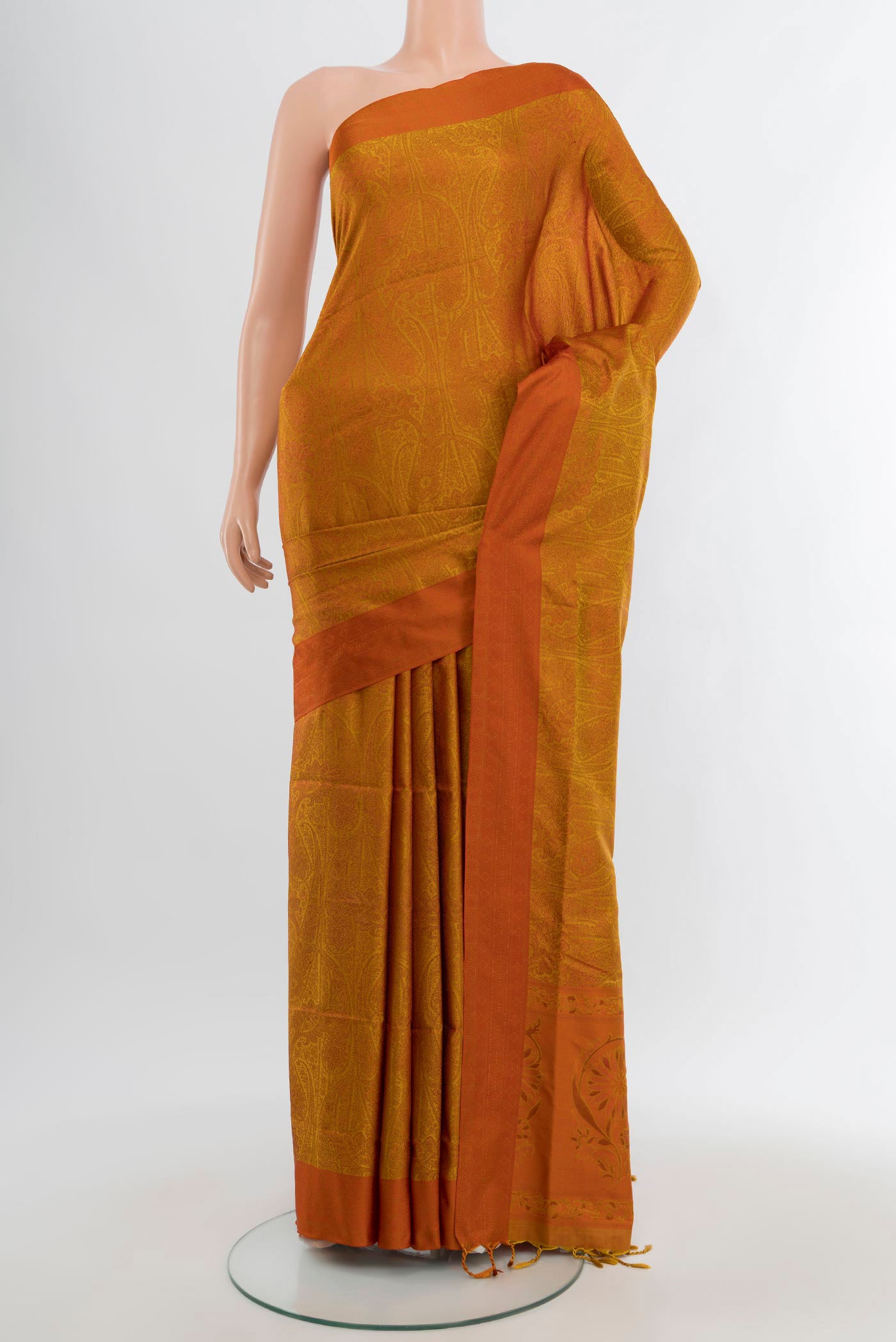 Mustard Soft Silk Saree with Jacquard design on the body and Thread Border.  displayed on a mannequin