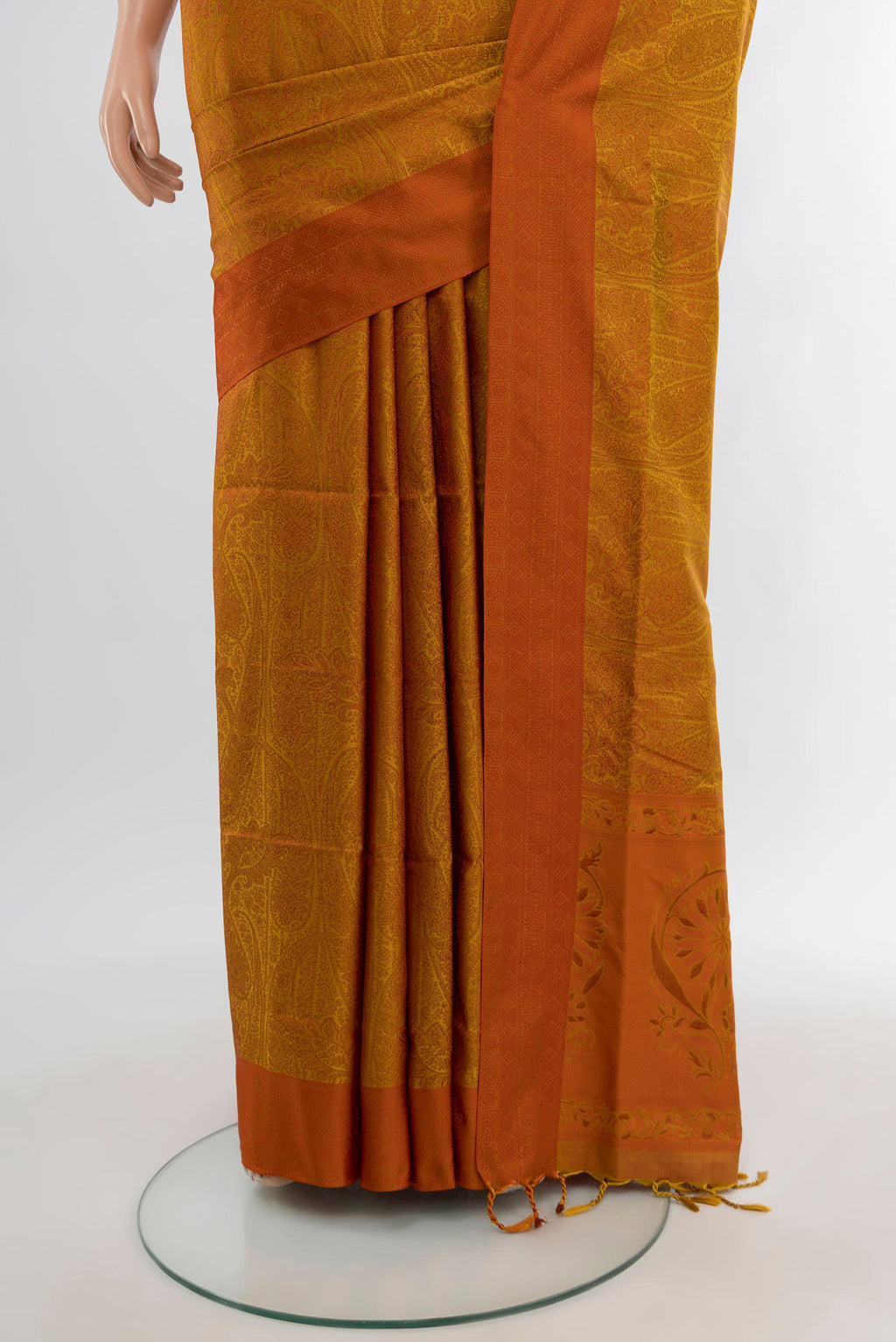 Pleats and pallu of Mustard Soft Silk Saree with Jacquard design on the body and Thread Border. 