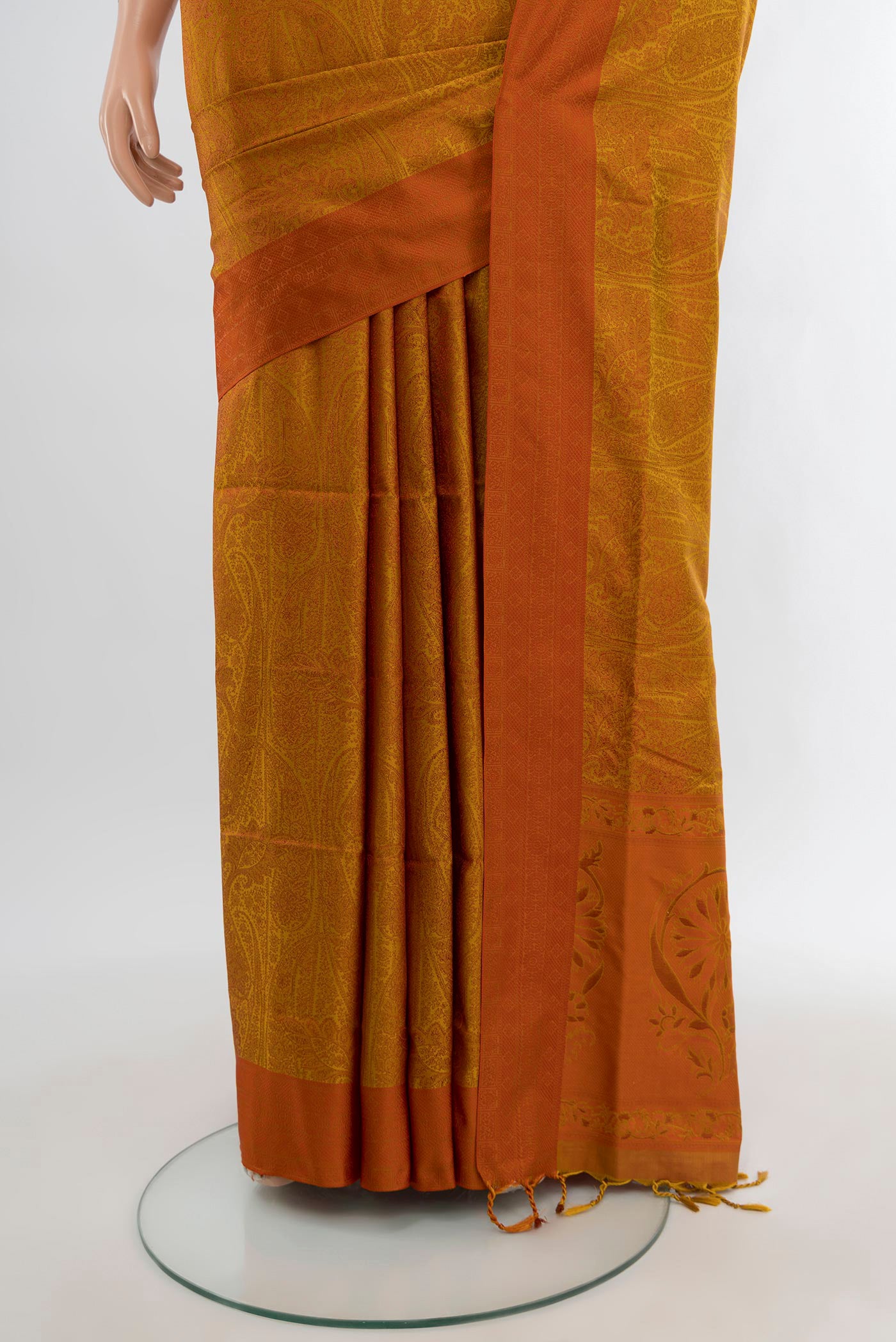 Pleats and pallu of Mustard Soft Silk Saree with Jacquard design on the body and Thread Border. 