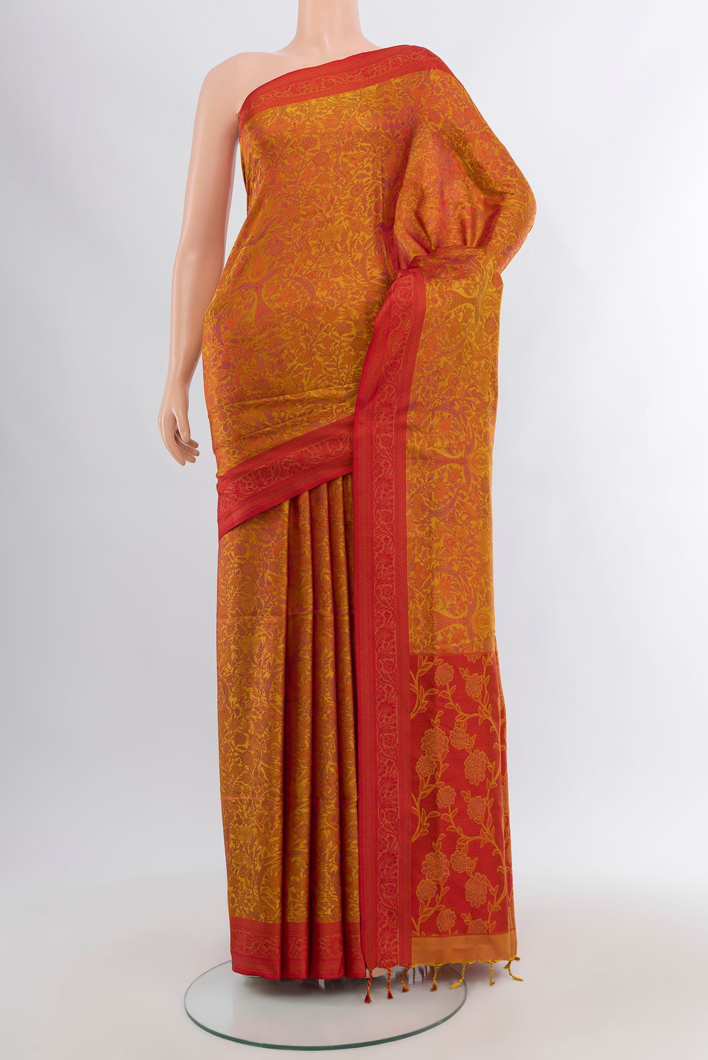 Mustard Soft Silk Saree with Jacquard design on the body and Thread Border.  displayed on a mannequin