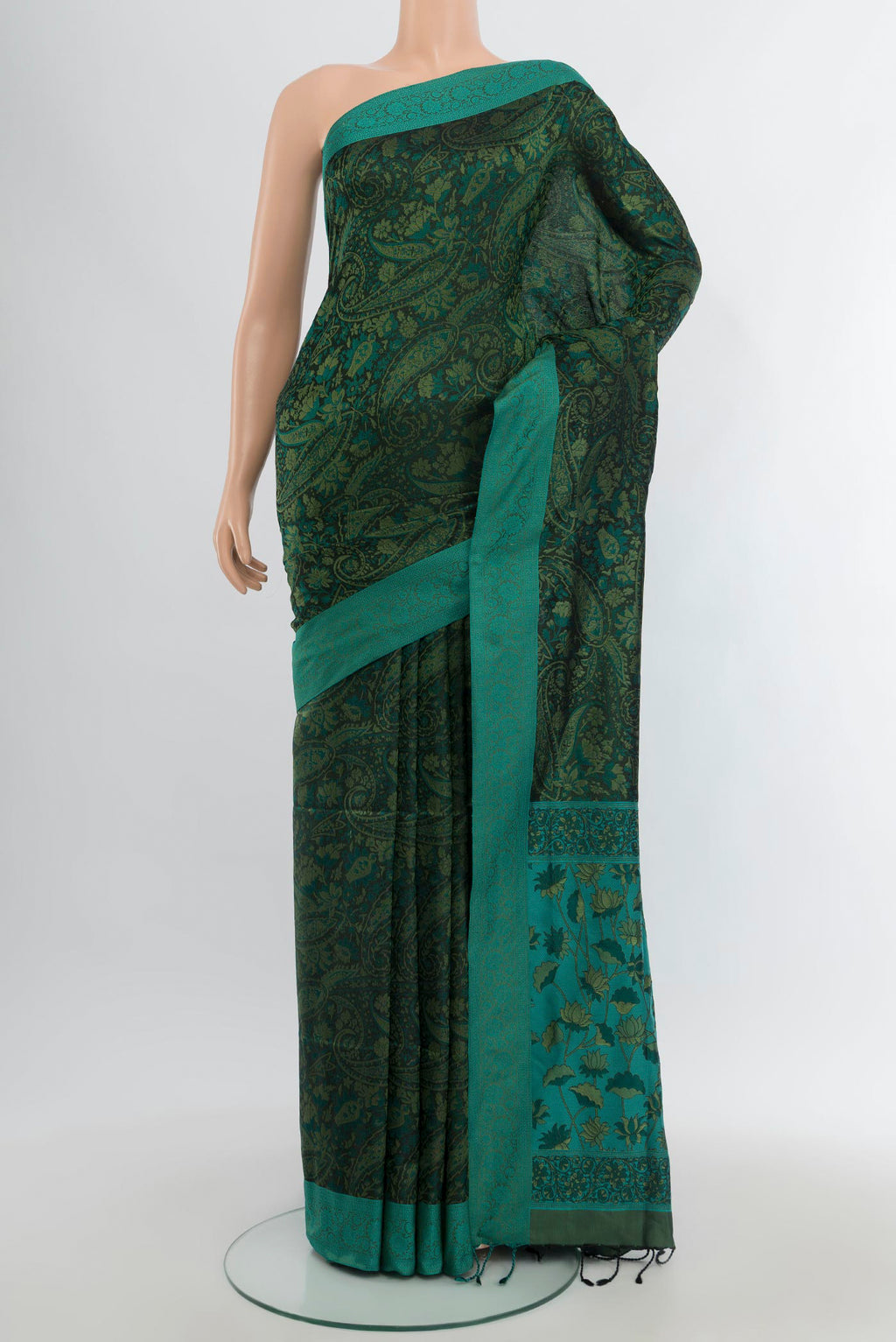Bottle Green Soft Silk Saree with Jacquard design on the body and Thread Border.  displayed on a mannequin