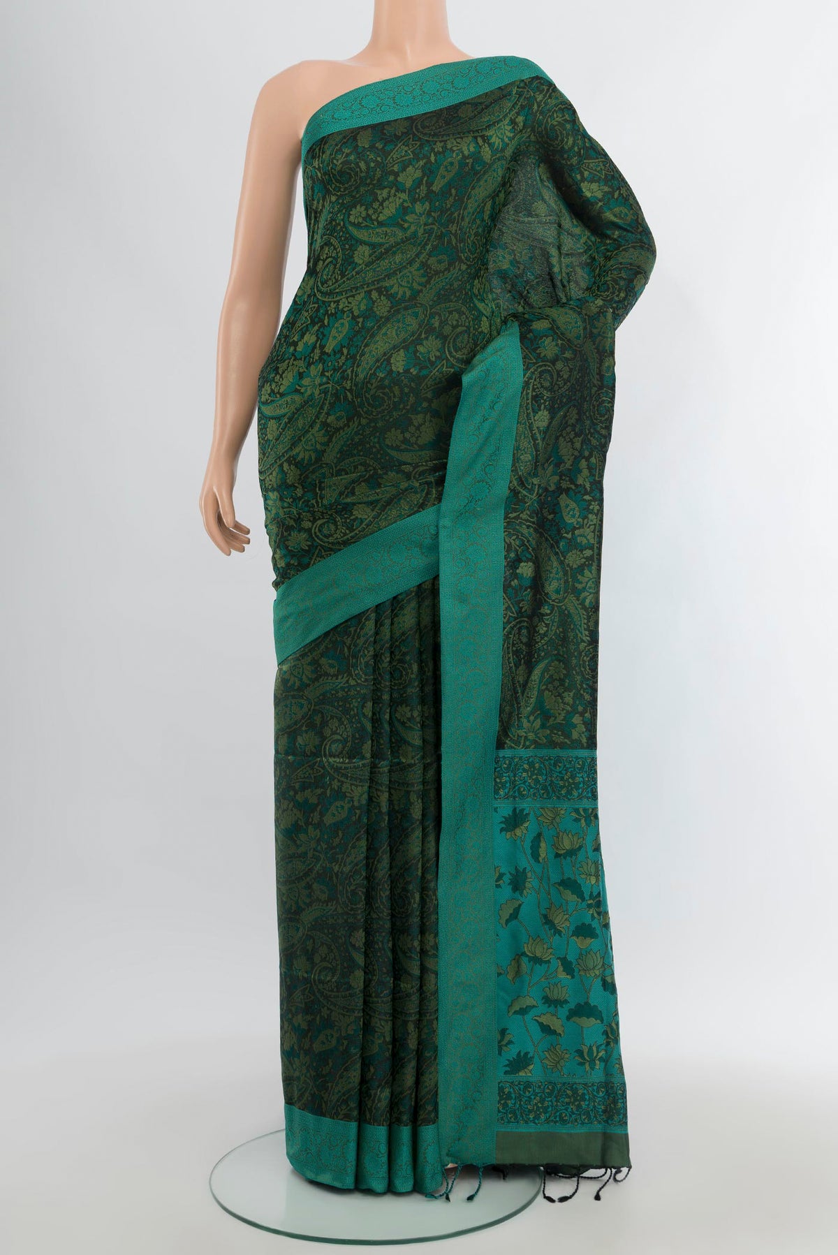 Bottle Green Soft Silk Saree with Jacquard design on the body and Thread Border.  displayed on a mannequin