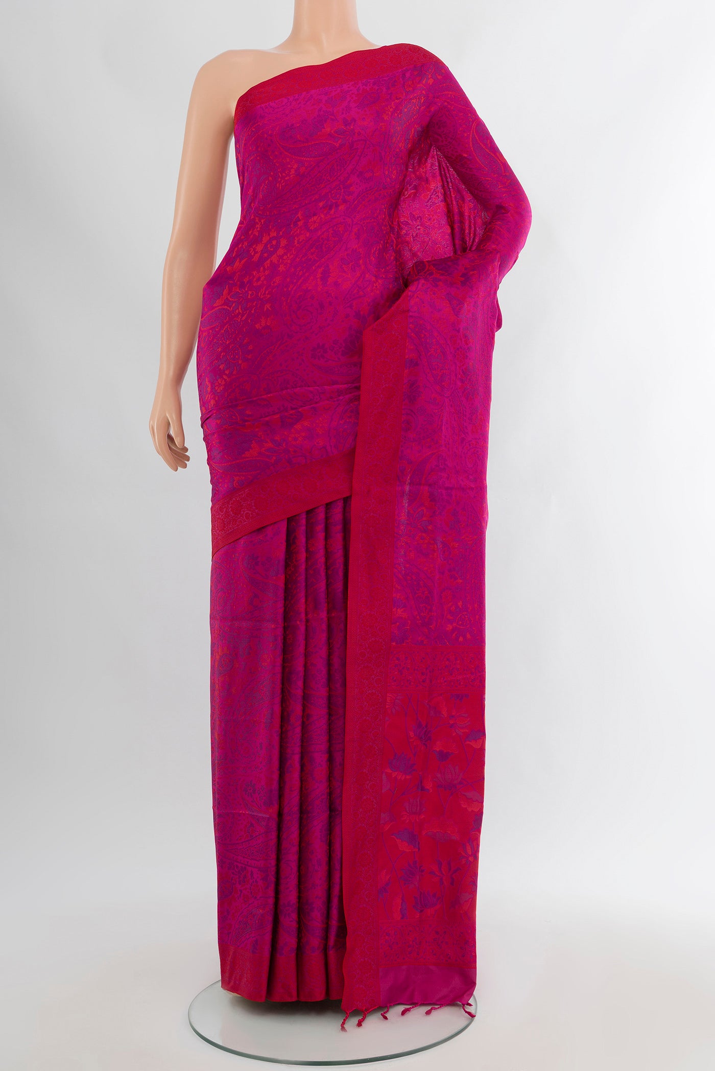 Magenta Soft Silk Saree with Jacquard design on the body and Thread Border.  displayed on a mannequin