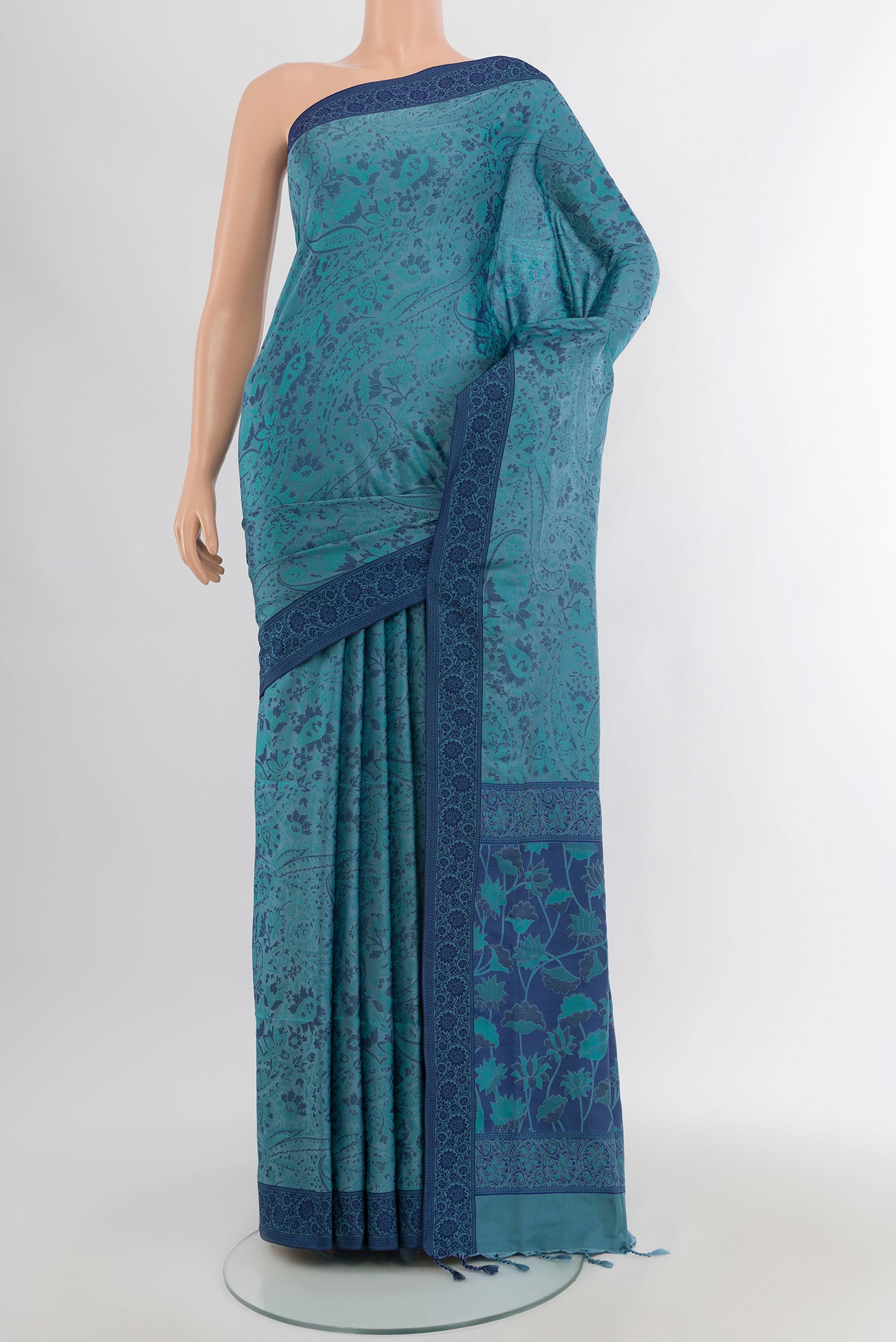 Grey Soft Silk Saree with Jacquard design on the body and Thread Border.  displayed on a mannequin