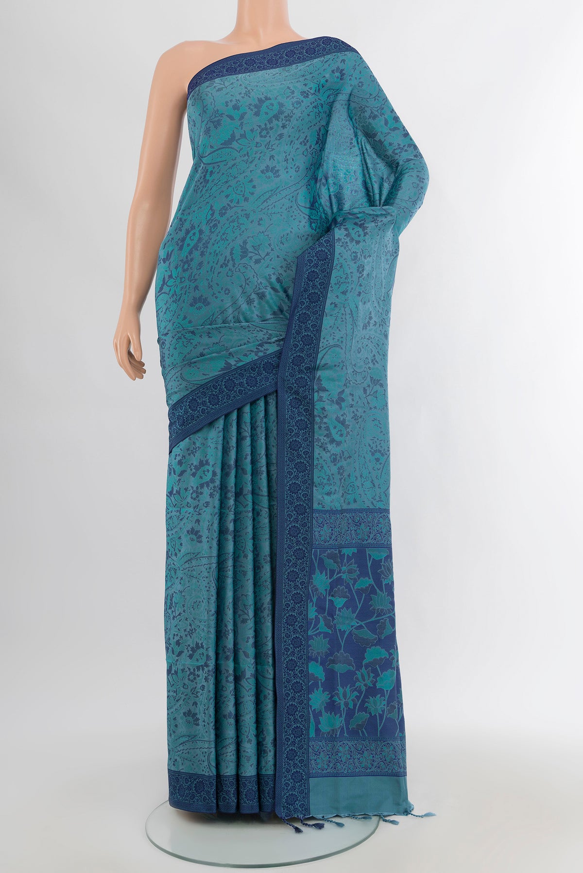 Grey Soft Silk Saree with Jacquard design on the body and Thread Border.  displayed on a mannequin