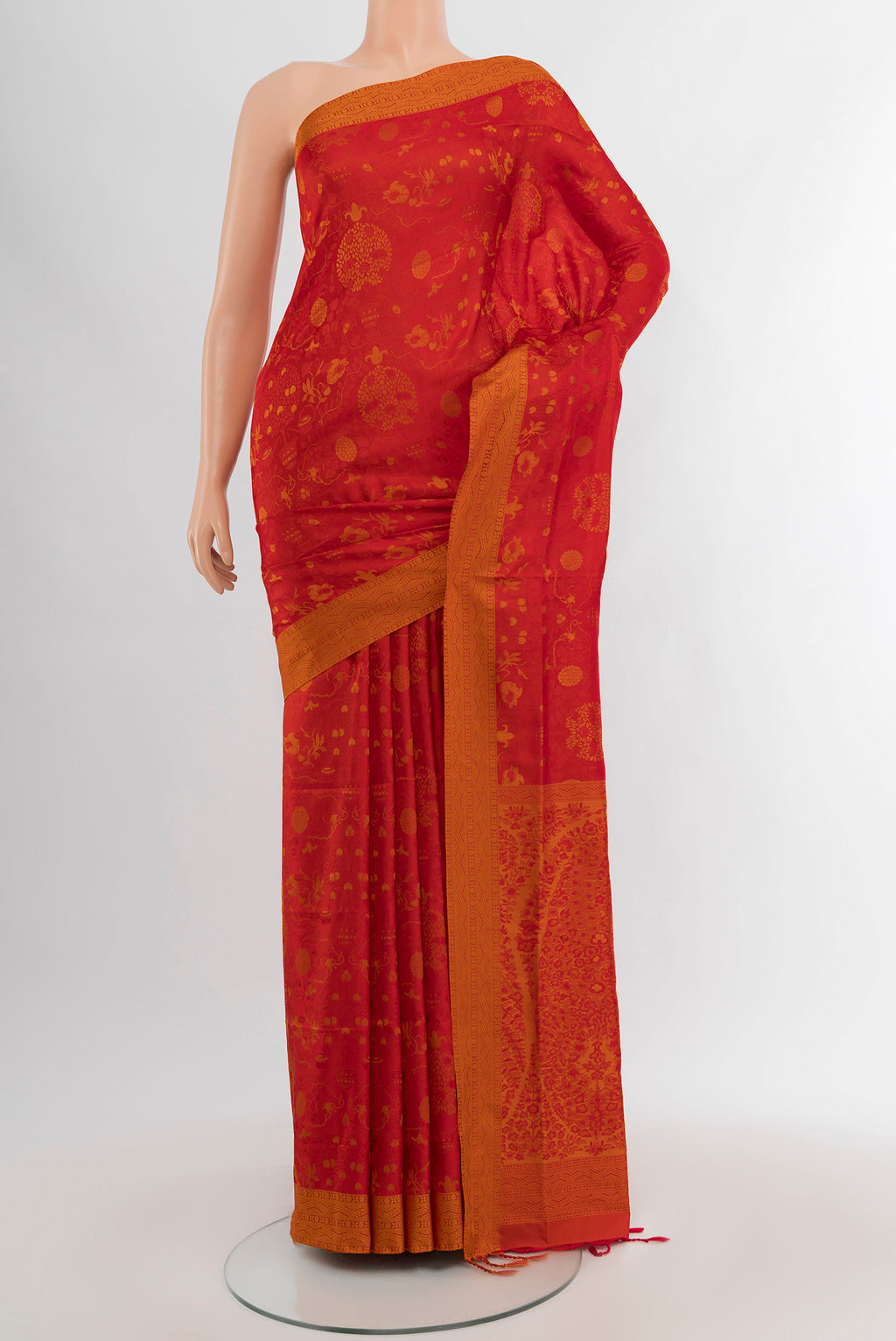Red Soft Silk Saree with Jacquard design on the body and Thread Border.  displayed on a mannequin