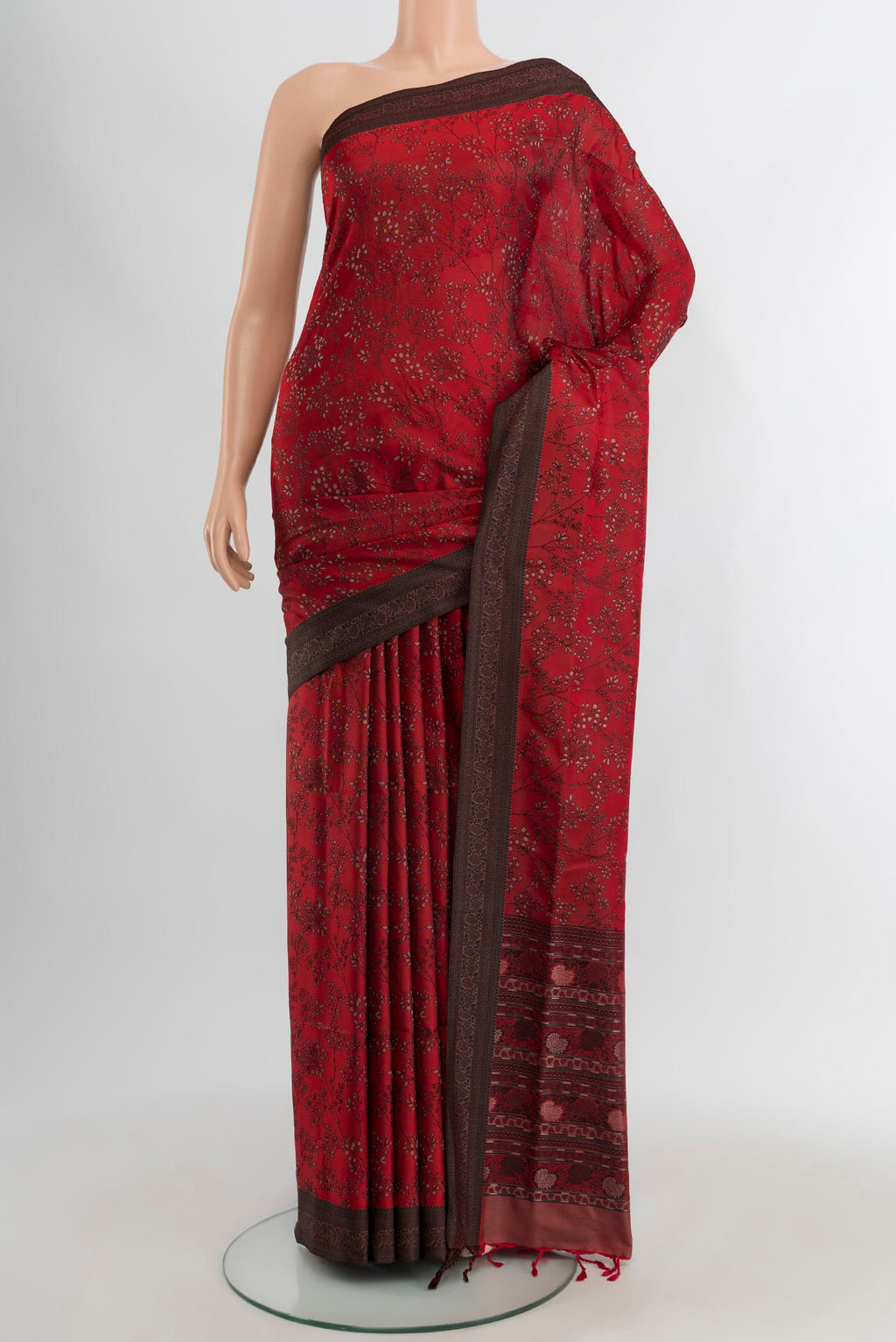 Maroon Soft Silk Saree with Jacquard design on the body and Thread Border.  displayed on a mannequin