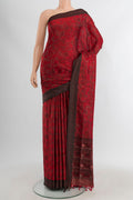 Maroon Soft Silk Saree with Jacquard design on the body and Thread Border.  displayed on a mannequin