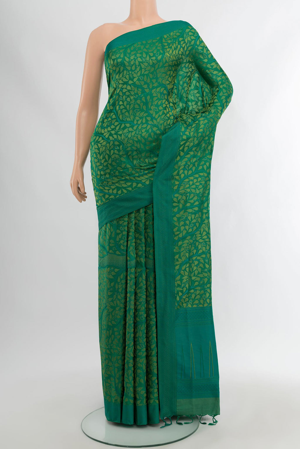 Green Soft Silk Saree with Jacquard design on the body and Thread Border.  displayed on a mannequin