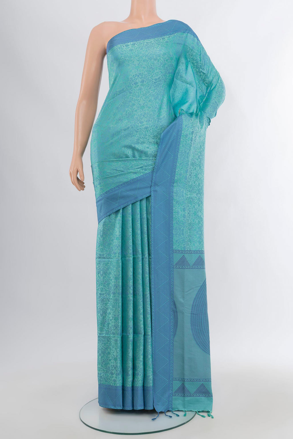 Light Blue Soft Silk Saree with Jacquard design on the body and Thread Border.  displayed on a mannequin