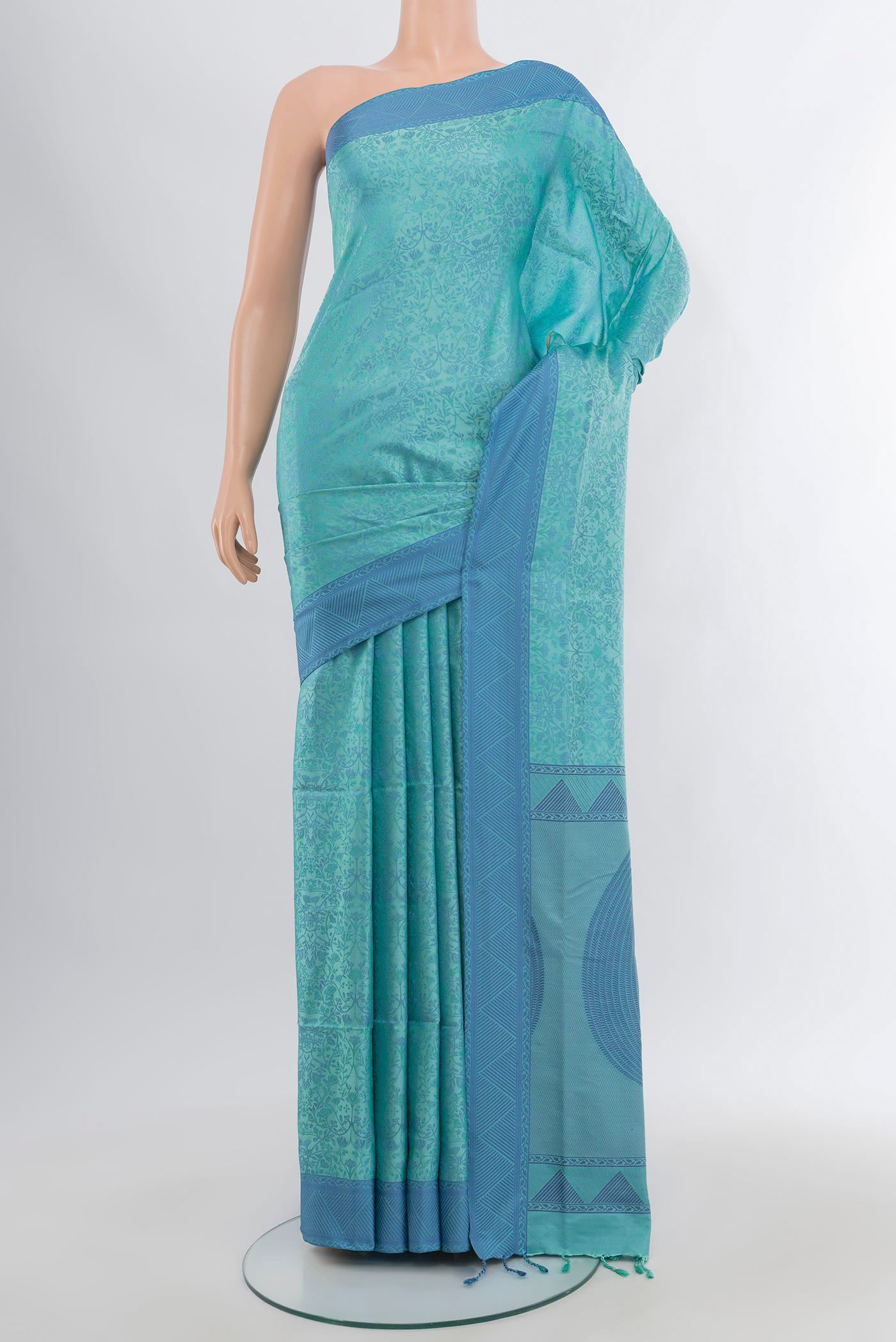 Light Blue Soft Silk Saree with Jacquard design on the body and Thread Border.  displayed on a mannequin