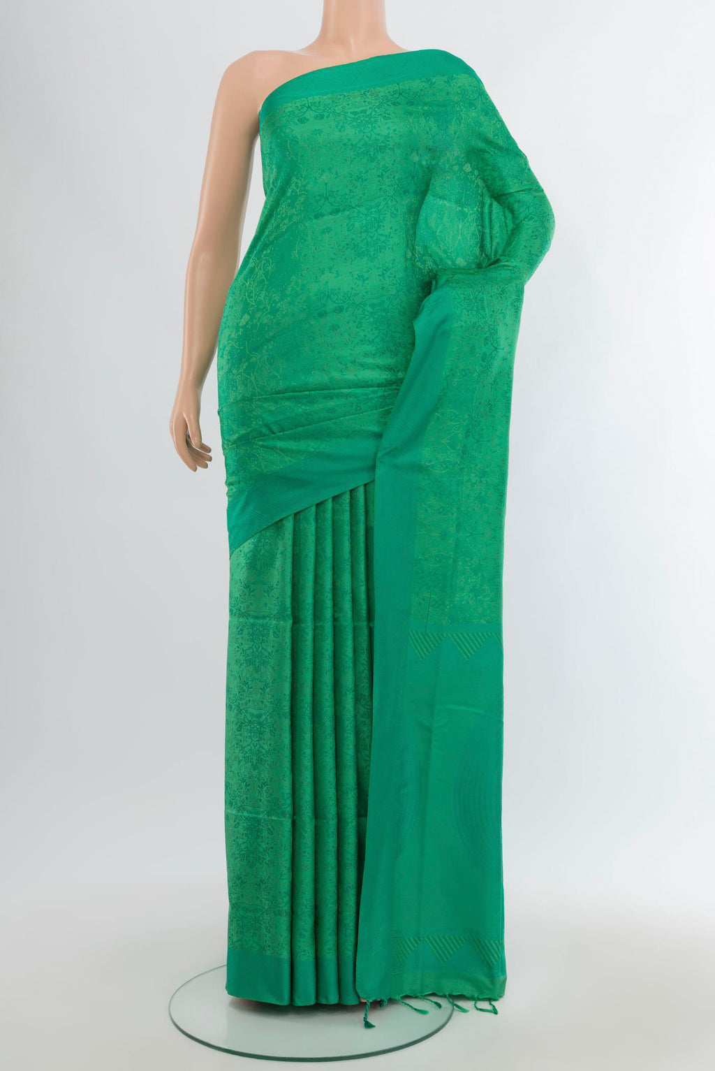Green Soft Silk Saree with Jacquard design on the body and Thread Border.  displayed on a mannequin