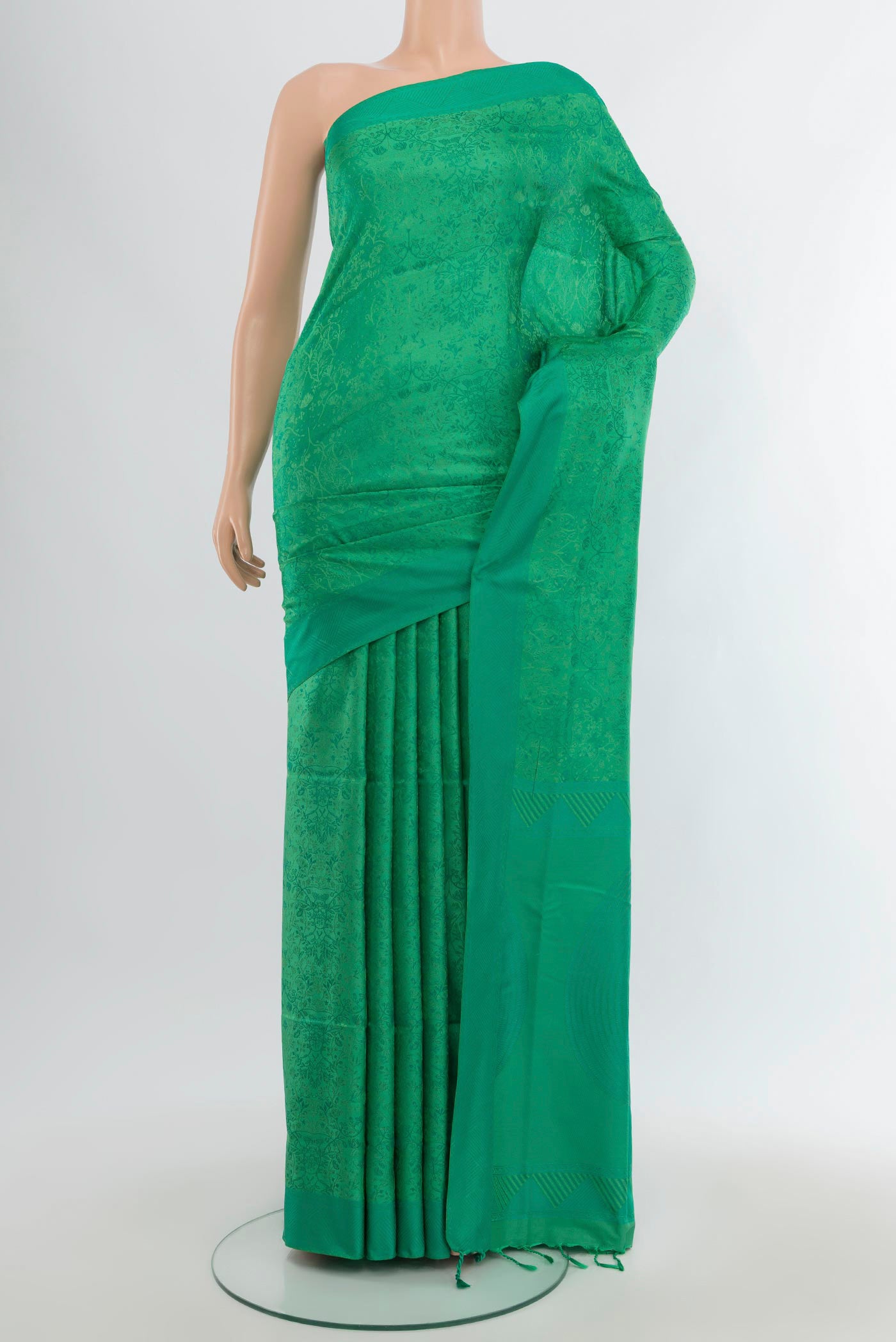 Green Soft Silk Saree with Jacquard design on the body and Thread Border.  displayed on a mannequin