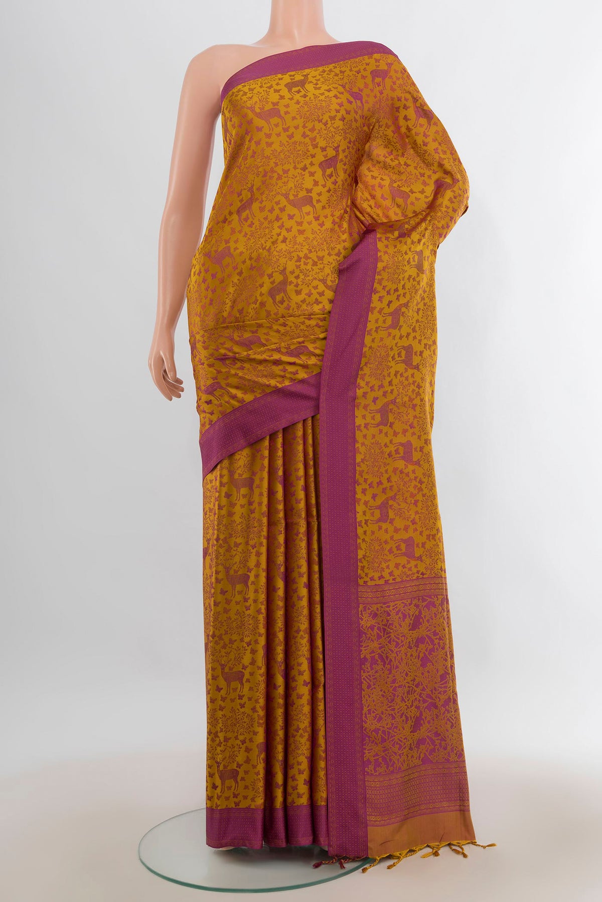Pure Silk Mustard Soft Saree with Jacquard design on the body and Thread Border.  displayed on a mannequin
