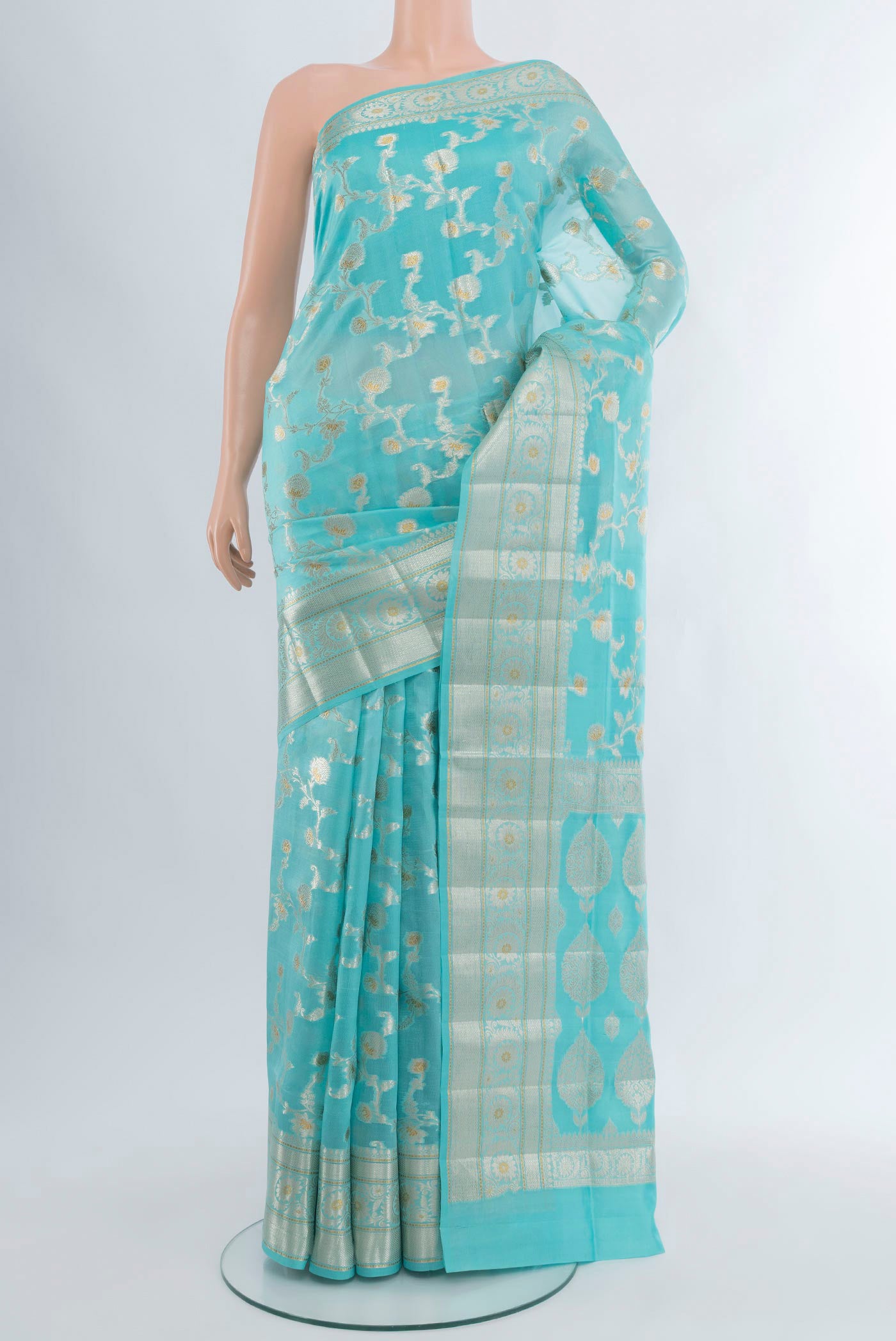 Sky Blue Banarasi Raw Silk Saree with Zari Butta on the body and Zari Border.  displayed on a mannequin