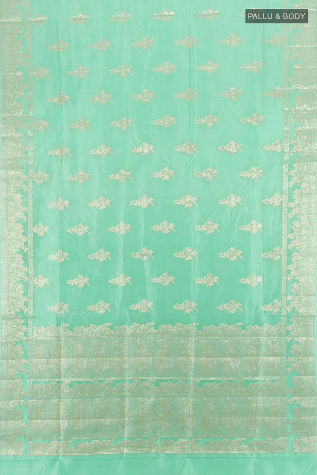 Flat view of Sea Green Banarasi Raw Silk Saree with Zari Butta on the body and Zari Border. 