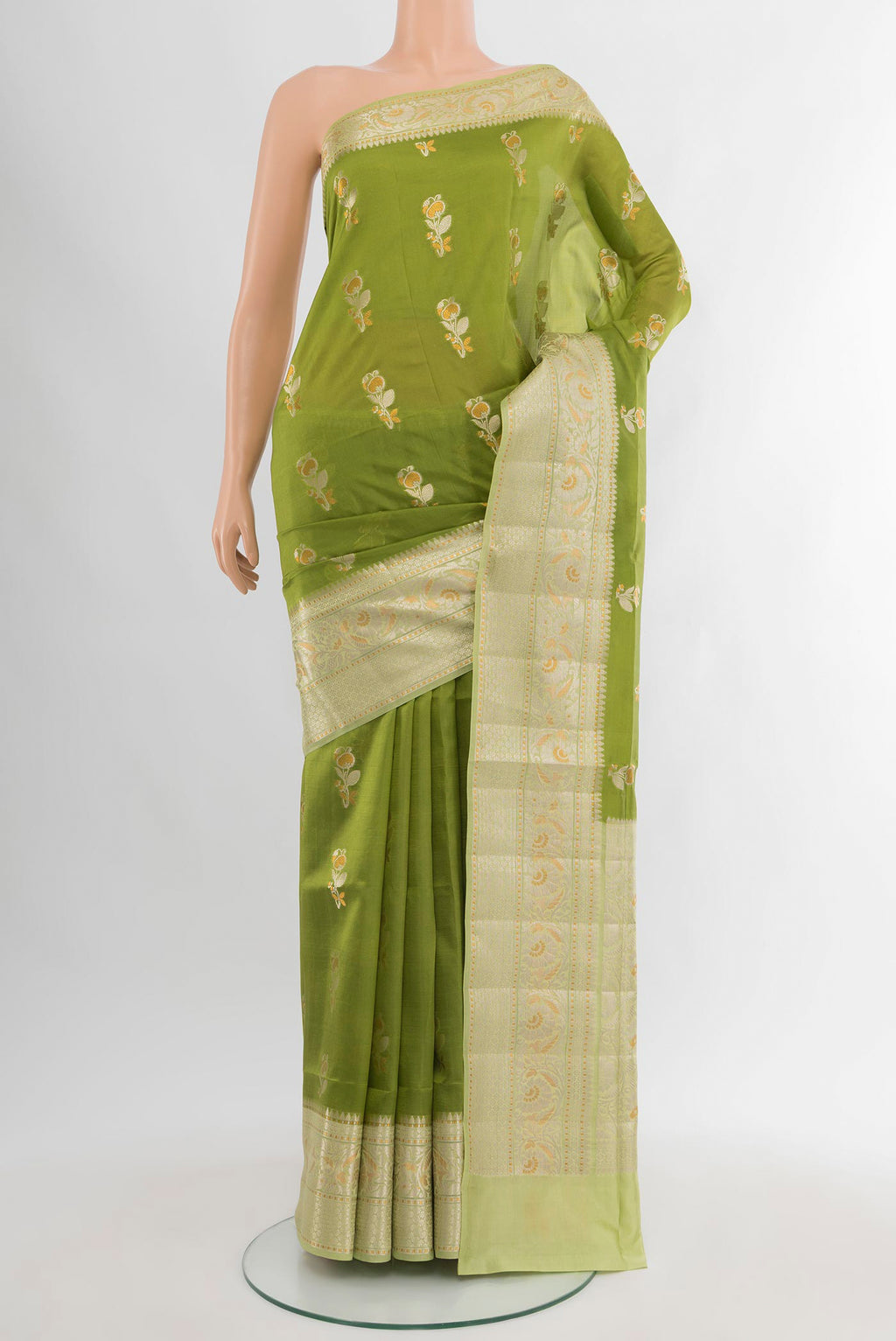 Green Banarasi Katan Silk Saree with Zari Butta on the body and Zari Border.  displayed on a mannequin