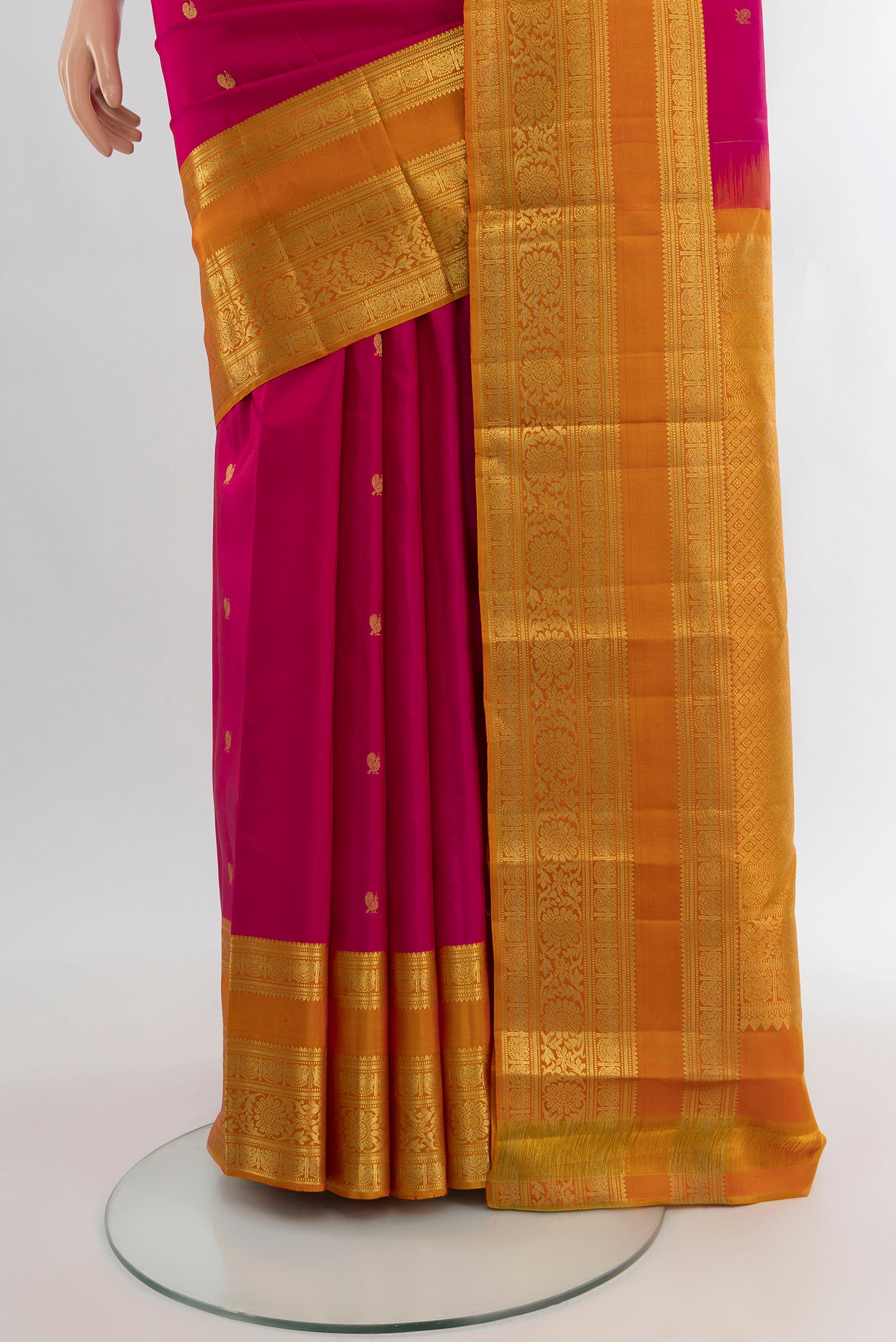 Pleats and pallu of Dark Pink Kanchipuram Silk Saree with Zari Butta on the body and Zari Border. 