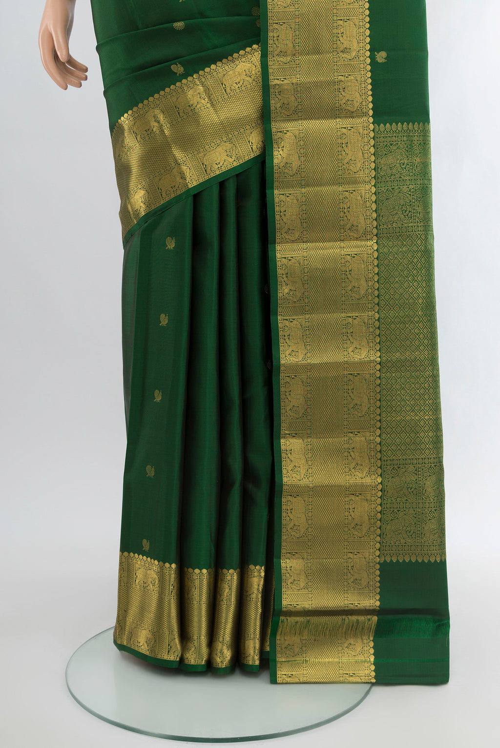 Pleats and pallu of Bottle Green Kanchipuram Silk Saree with Zari Butta on the body and Zari Border. 