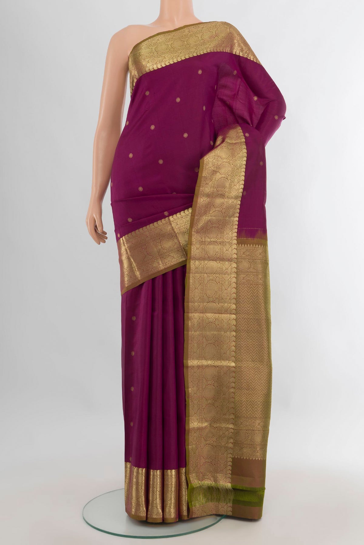 Pure Silk Maroon Kanchipuram Saree with Zari Butta on the body and Zari Border.  displayed on a mannequin