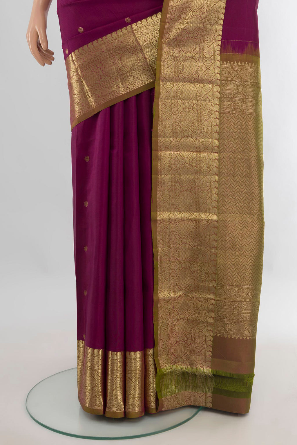Pleats and pallu of Pure Silk Maroon Kanchipuram Saree with Zari Butta on the body and Zari Border. 