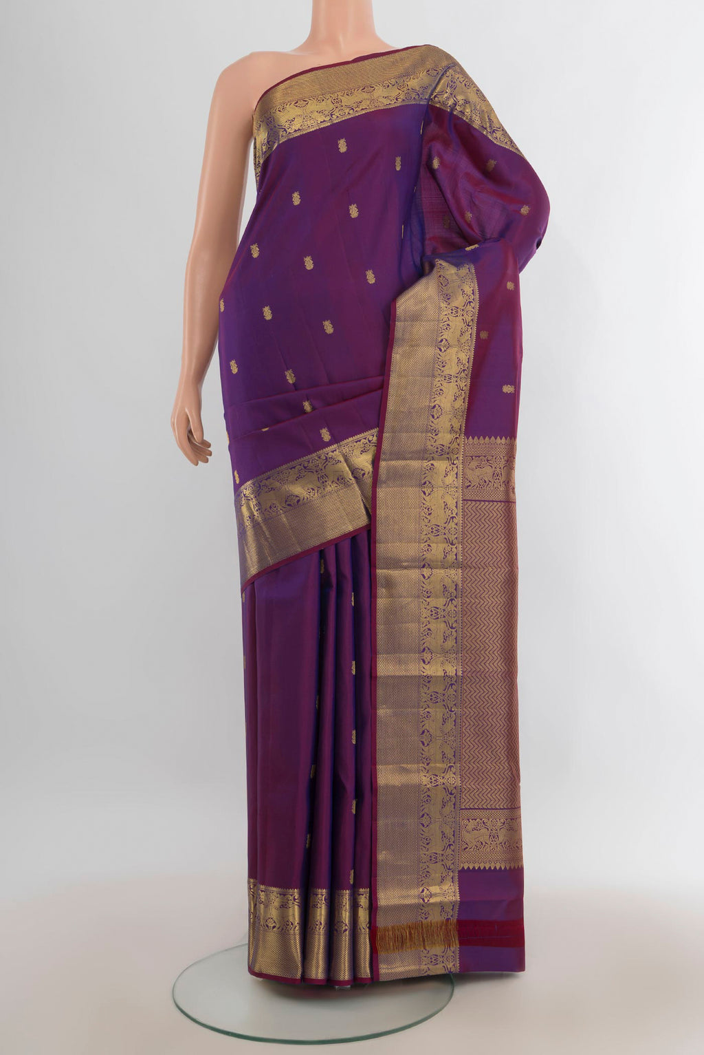 Pure Silk Violet Kanchipuram Saree with Zari Butta on the body and Silk Border.  displayed on a mannequin