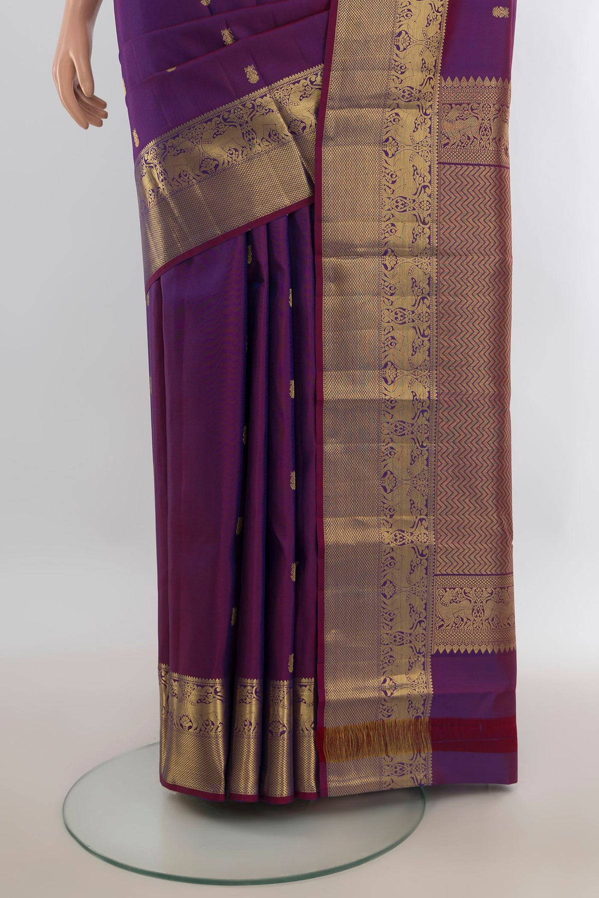 Pleats and pallu of Pure Silk Violet Kanchipuram Saree with Zari Butta on the body and Silk Border. 