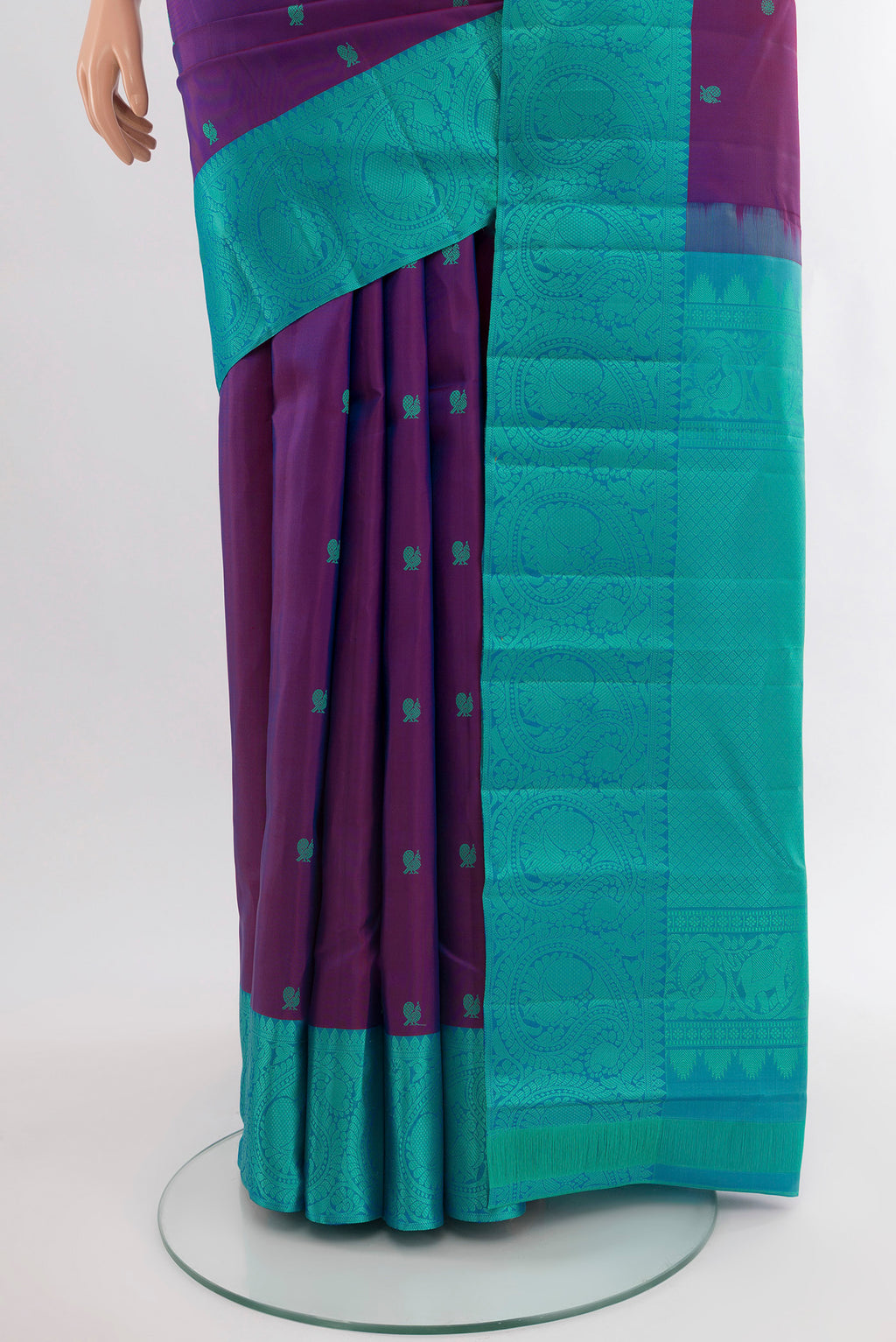 Pleats and pallu of Magenta Kanchipuram Silk Saree with Zari Butta on the body and Silk Border. 