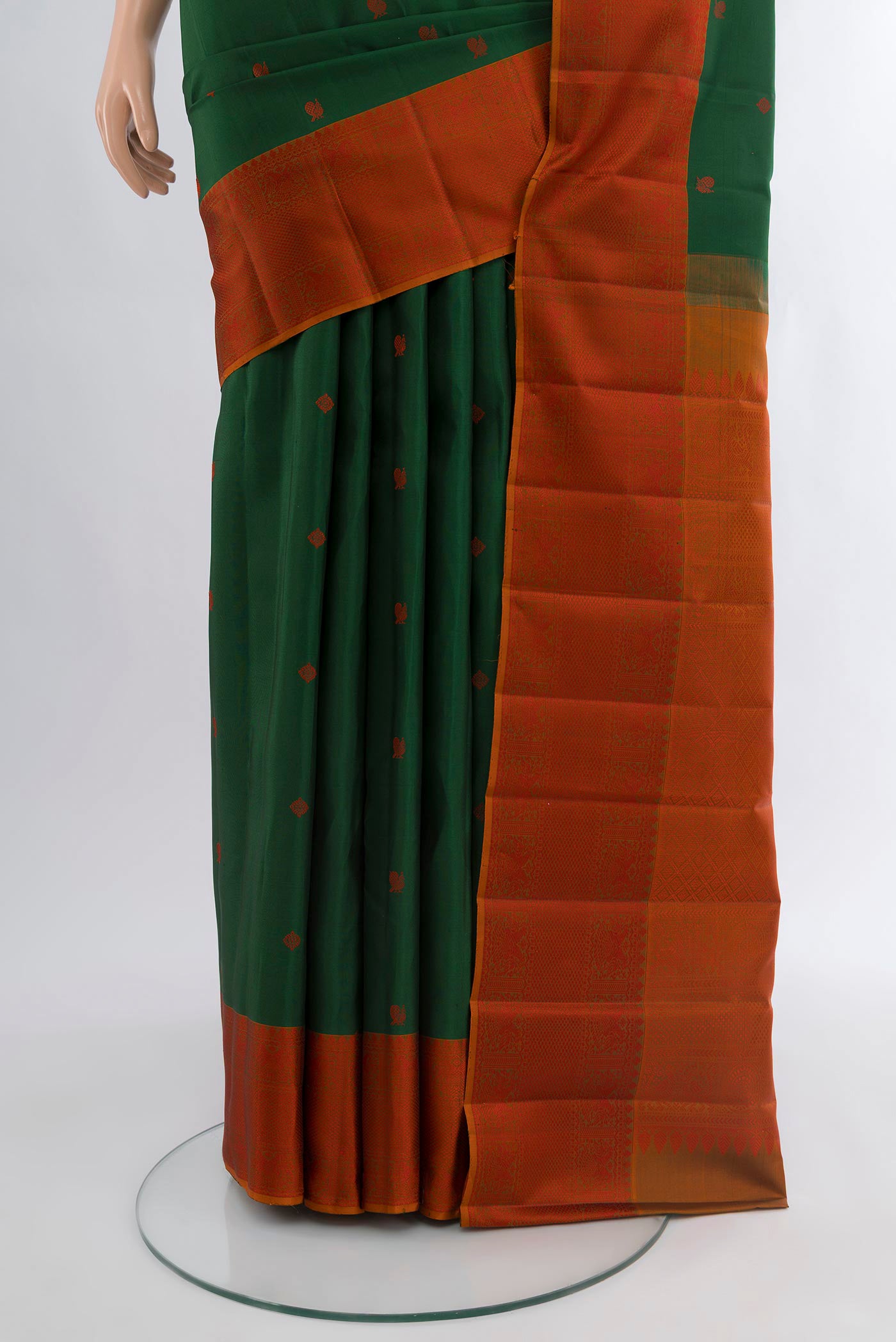 Pleats and pallu of Bottle Green Kanchipuram Silk Saree with Thread Butta on the body and Thread Border. 