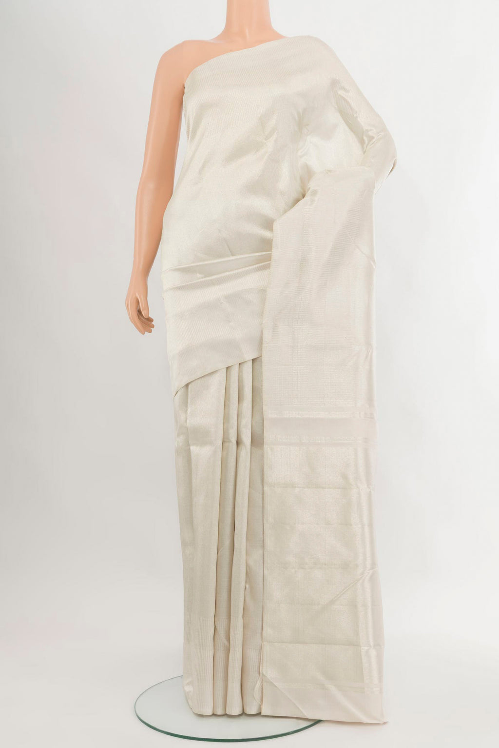 Off White Kanchipuram Silk Saree with Zari Brocade on the body and Without Border.  displayed on a mannequin