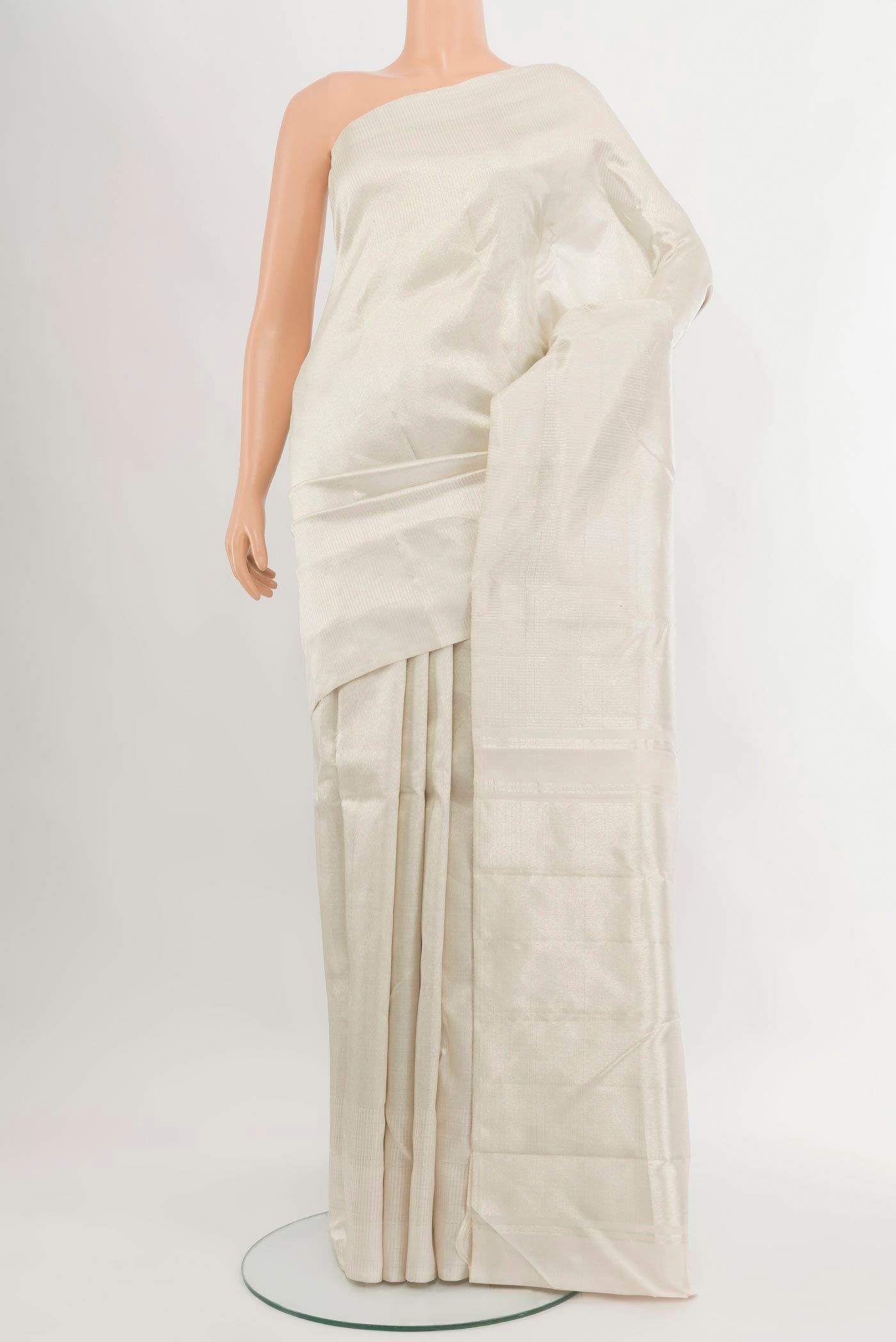 Off White Kanchipuram Silk Saree with Zari Brocade on the body and Without Border.  displayed on a mannequin
