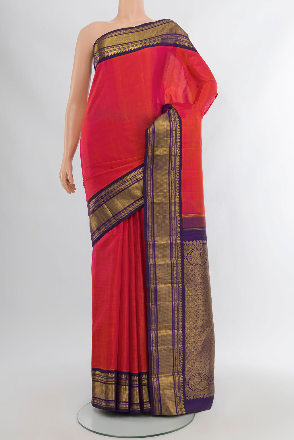 Pure Silk Pure Zari Peach Kanjivaram Saree with Plain Body and Silk Border.  displayed on a mannequin