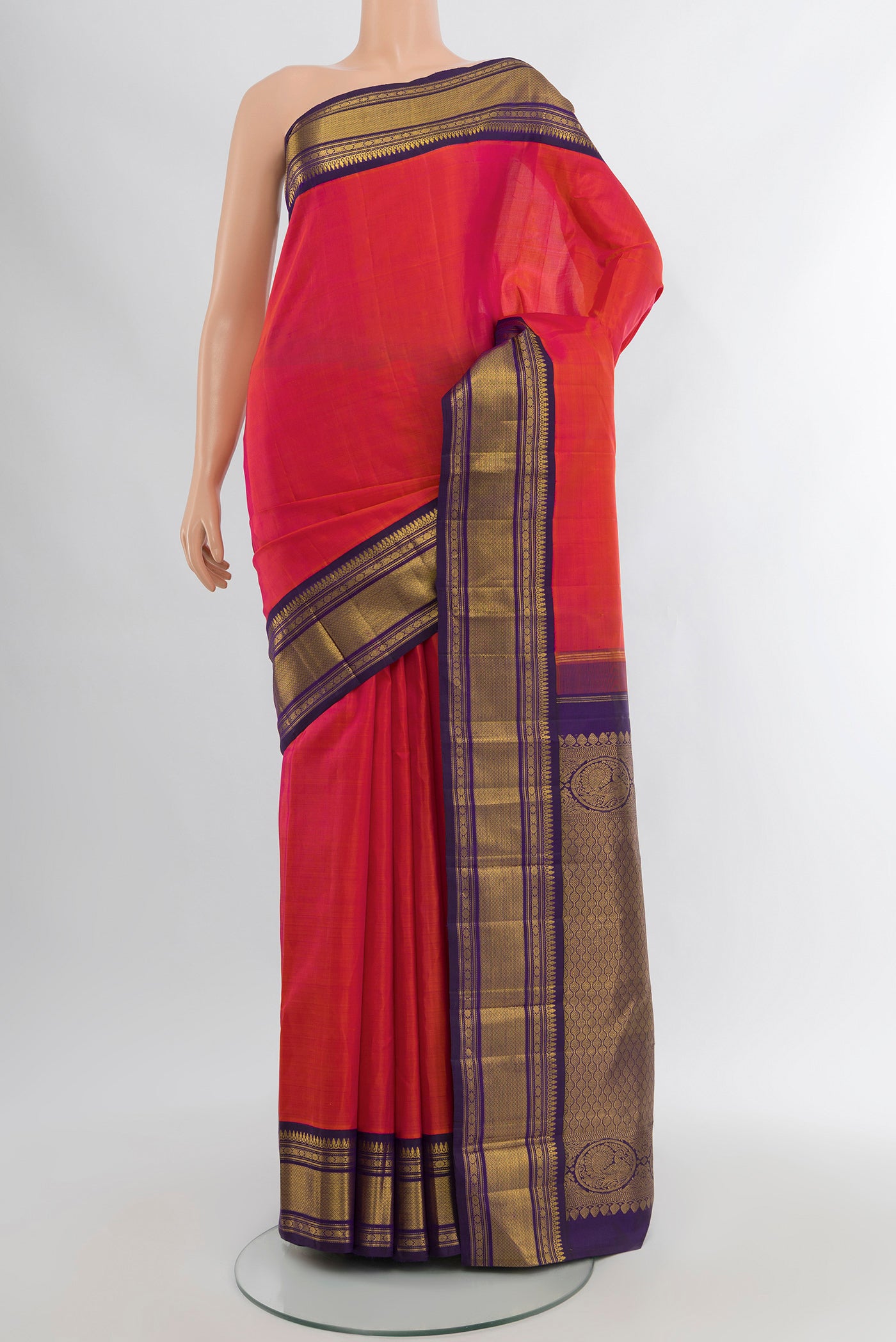 Pure Silk Pure Zari Peach Kanjivaram Saree with Plain Body and Silk Border.  displayed on a mannequin