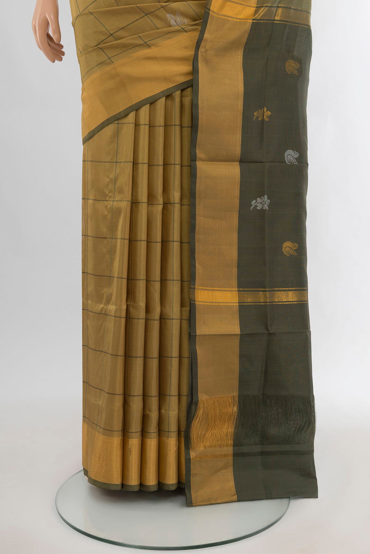 Pleats and pallu of Beige Uppada Silk Saree with Checked design on the body and Silk Border. 