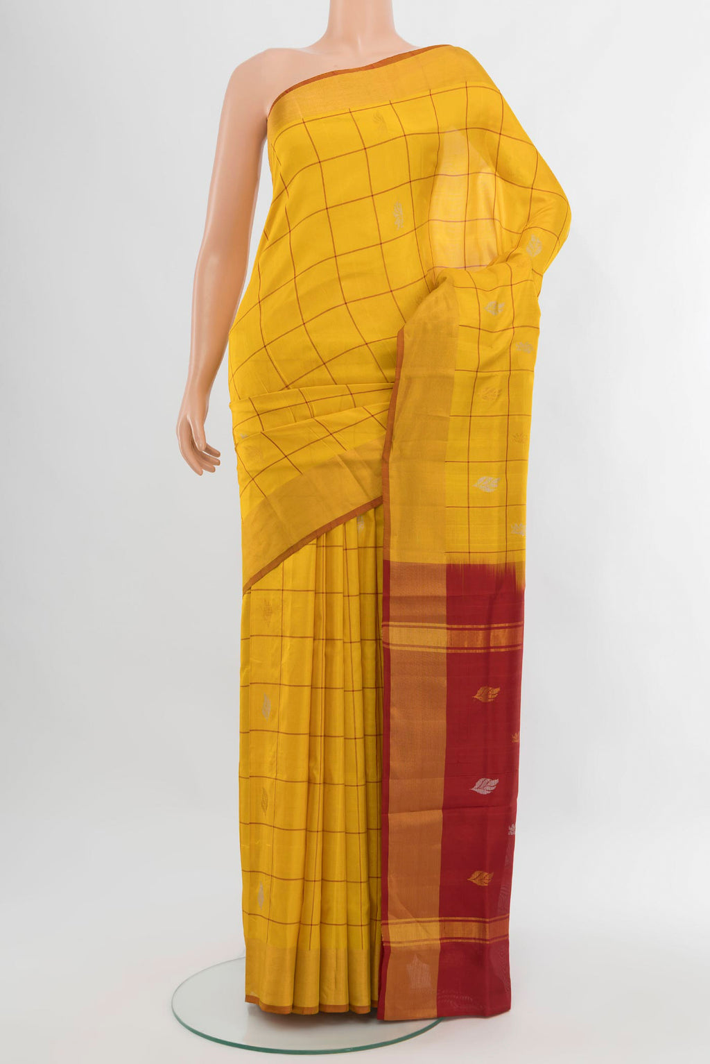 Yellow Uppada Silk Saree with Checked design on the body and Zari Border.  displayed on a mannequin