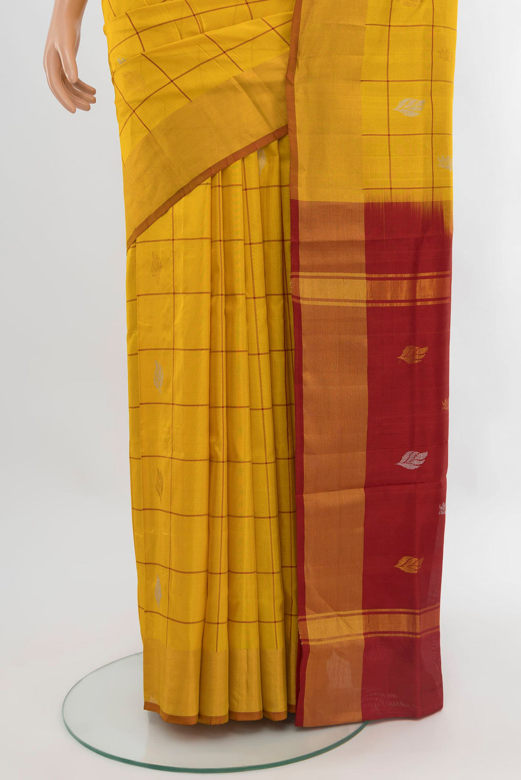 Pleats and pallu of Yellow Uppada Silk Saree with Checked design on the body and Zari Border. 