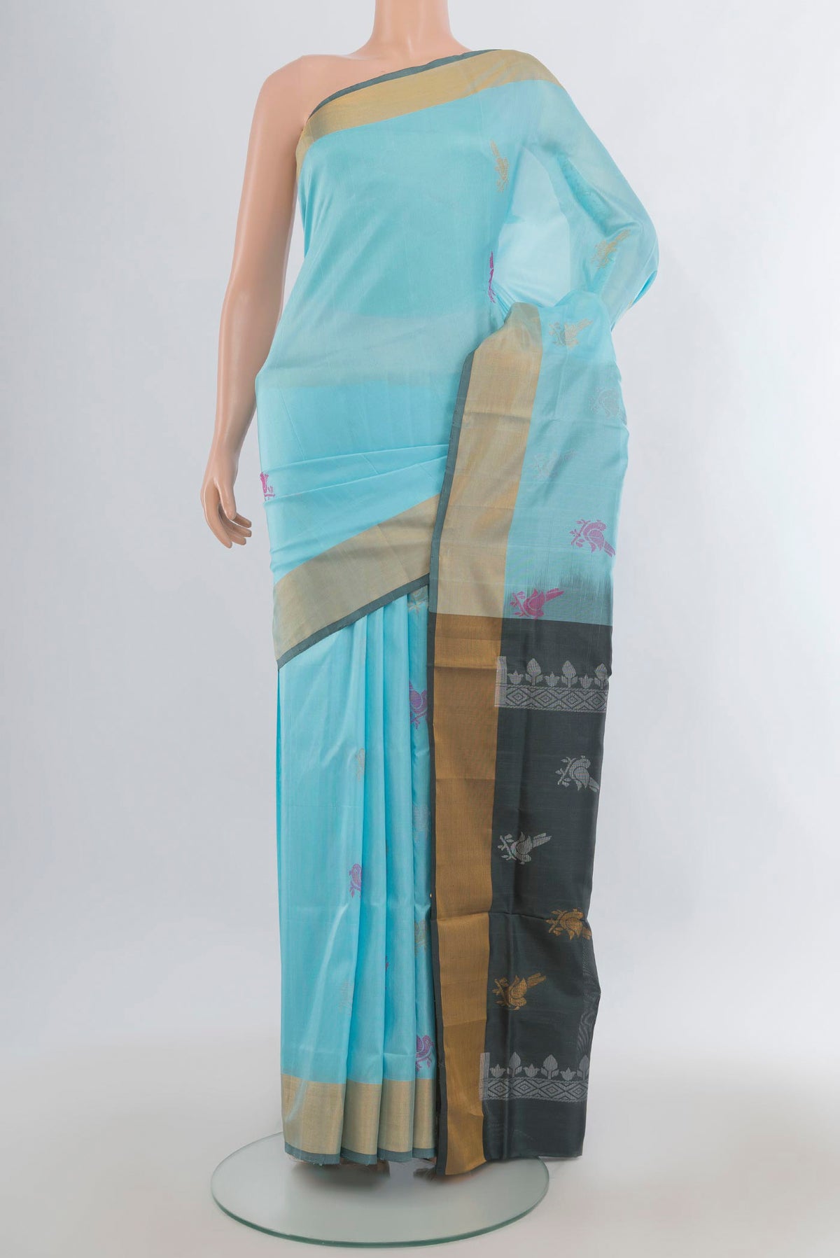 Pure Silk Sky Blue Uppada Saree with Zari Butta on the body and Zari Border.  displayed on a mannequin