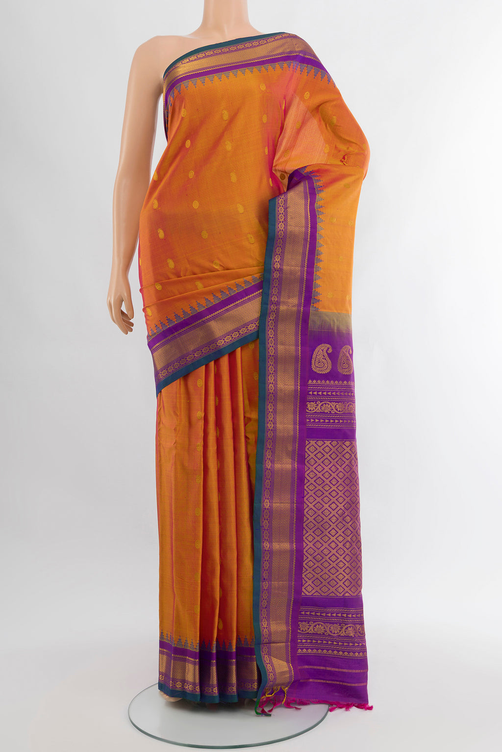 Pure Silk Pure Zari Golden Peach Gadwal Saree with Zari Butta on the body and Silk Border.  displayed on a mannequin
