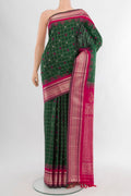 Bottle Green Gadwal Silk Saree with Checked design on the body and Zari Border.  displayed on a mannequin