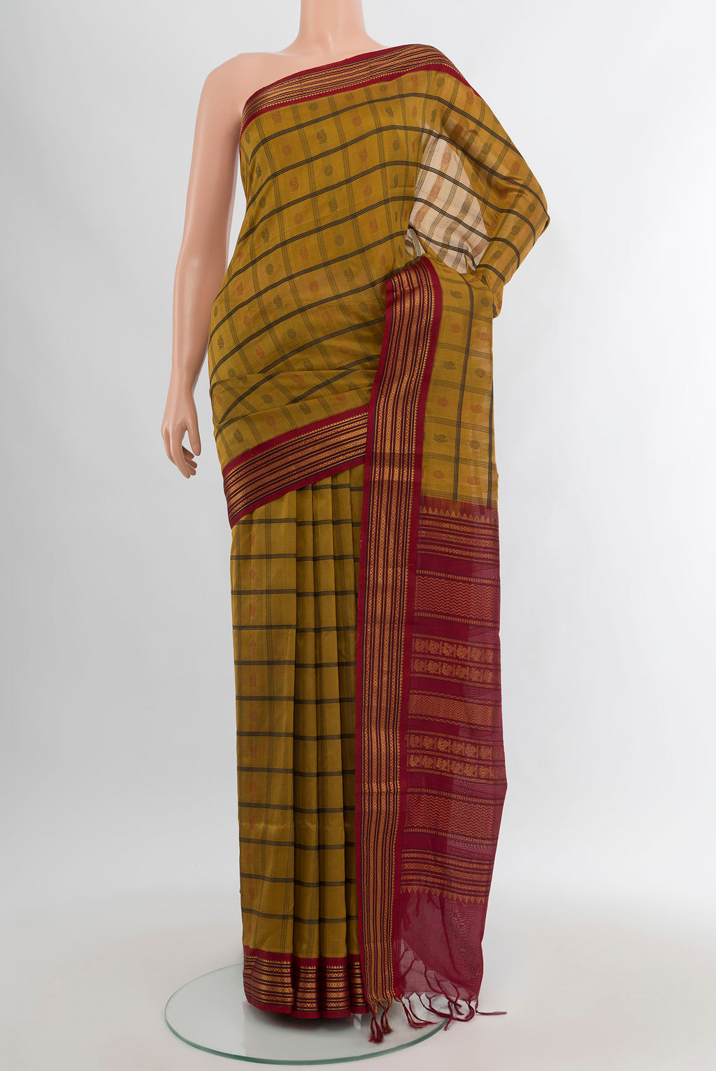 Mehandi Green Silk Cotton Saree with Checked design on the body and Zari Border.  displayed on a mannequin