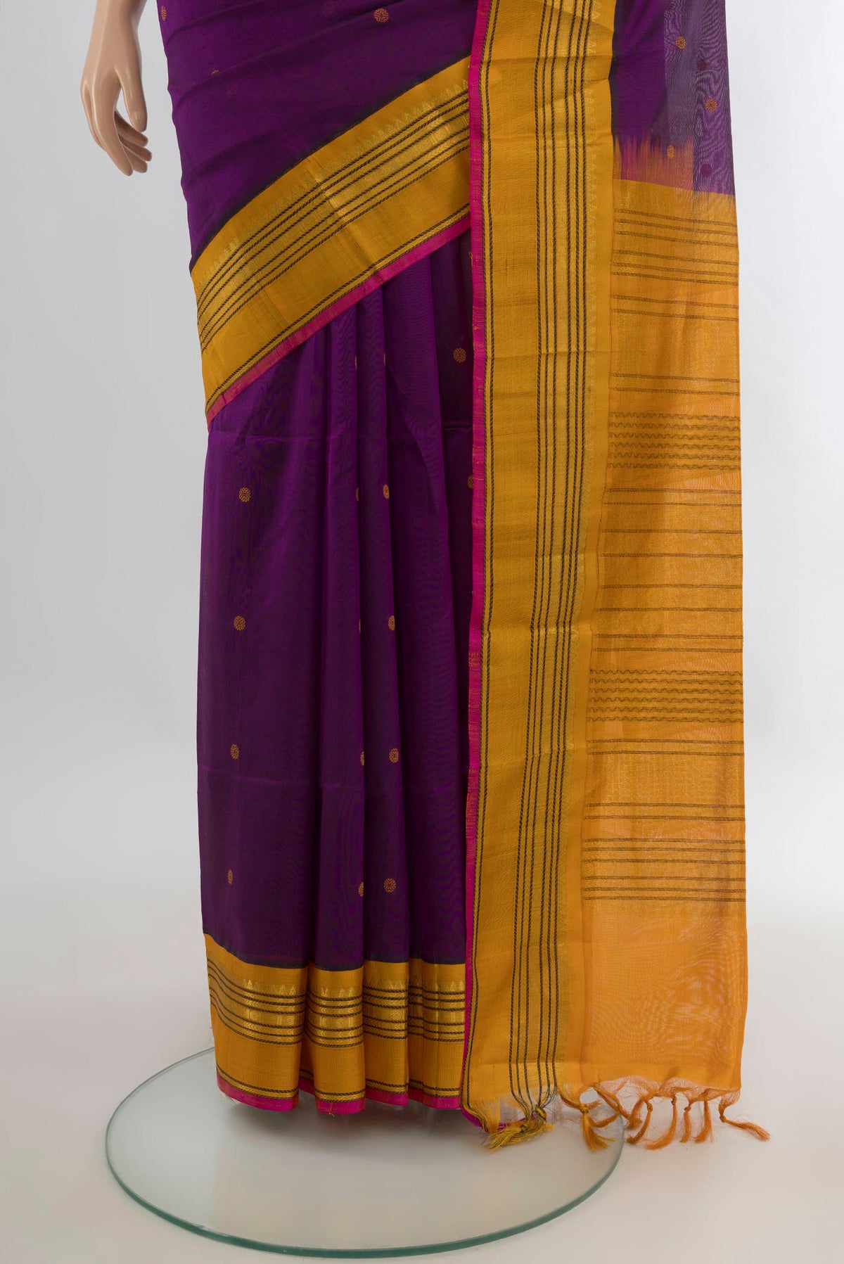 Pleats and pallu of Purple Silk Cotton Saree with Thread Butta on the body and Zari Border. 
