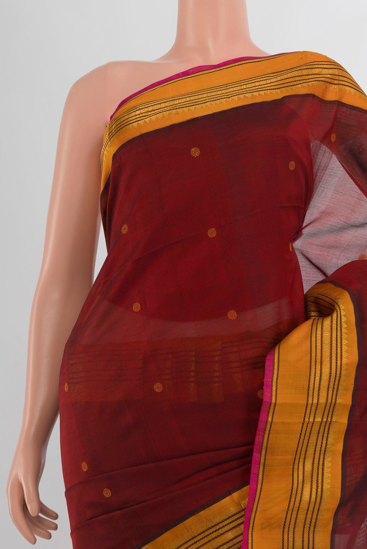 Border image of Maroon Silk Cotton Saree with Zari Butta on the body and Silk Border. 