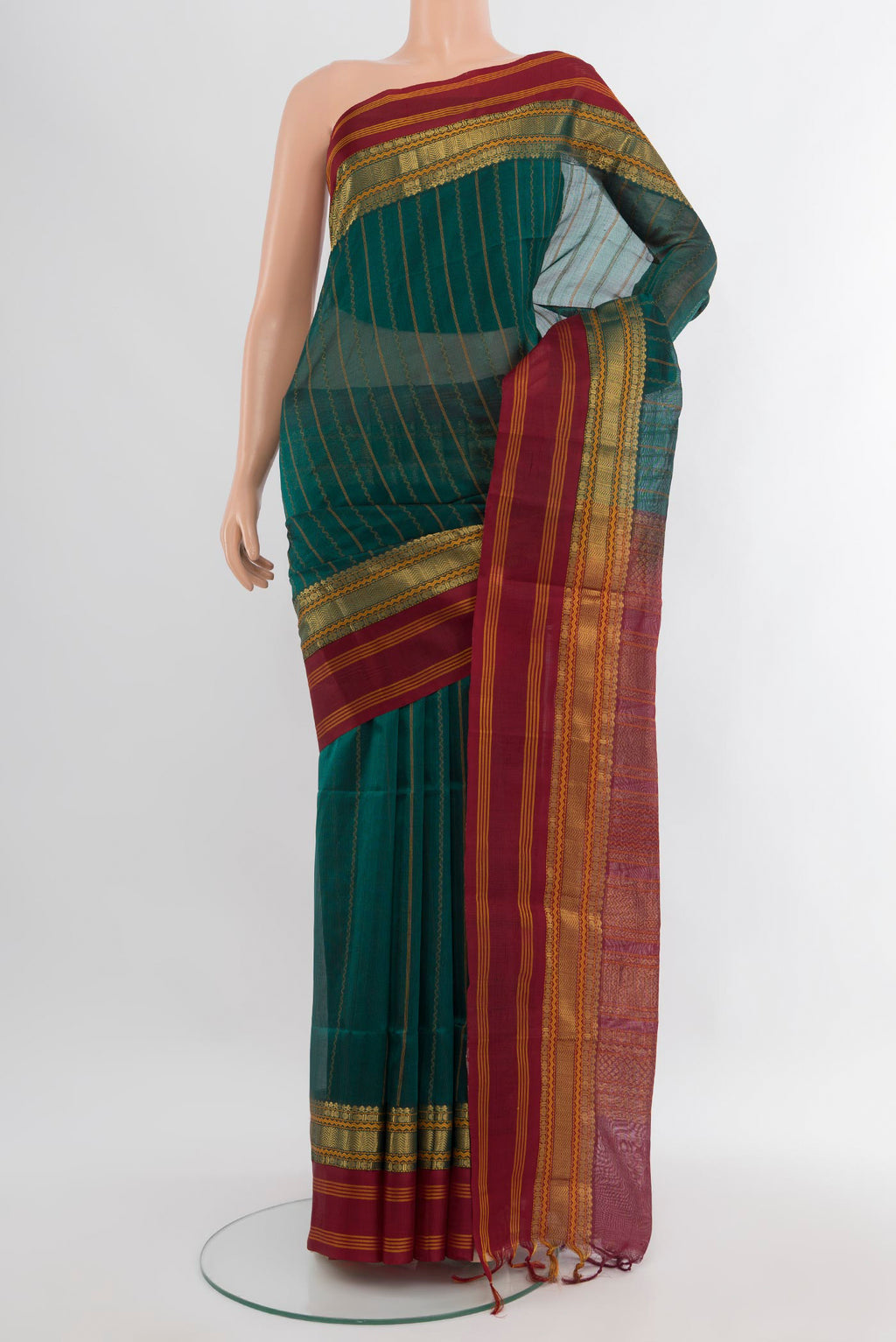 Sea Green Silk Cotton Saree with Stripes on the body and Zari Border.  displayed on a mannequin