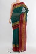 Sea Green Silk Cotton Saree with Stripes on the body and Zari Border.  displayed on a mannequin