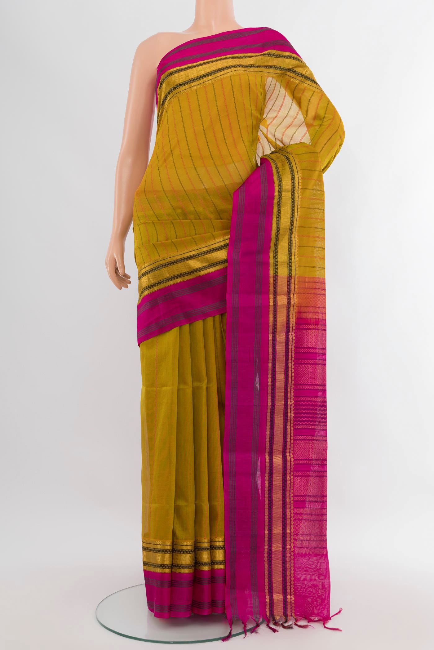 Mehandi Green Silk Cotton Saree with Stripes on the body and Zari Border.  displayed on a mannequin
