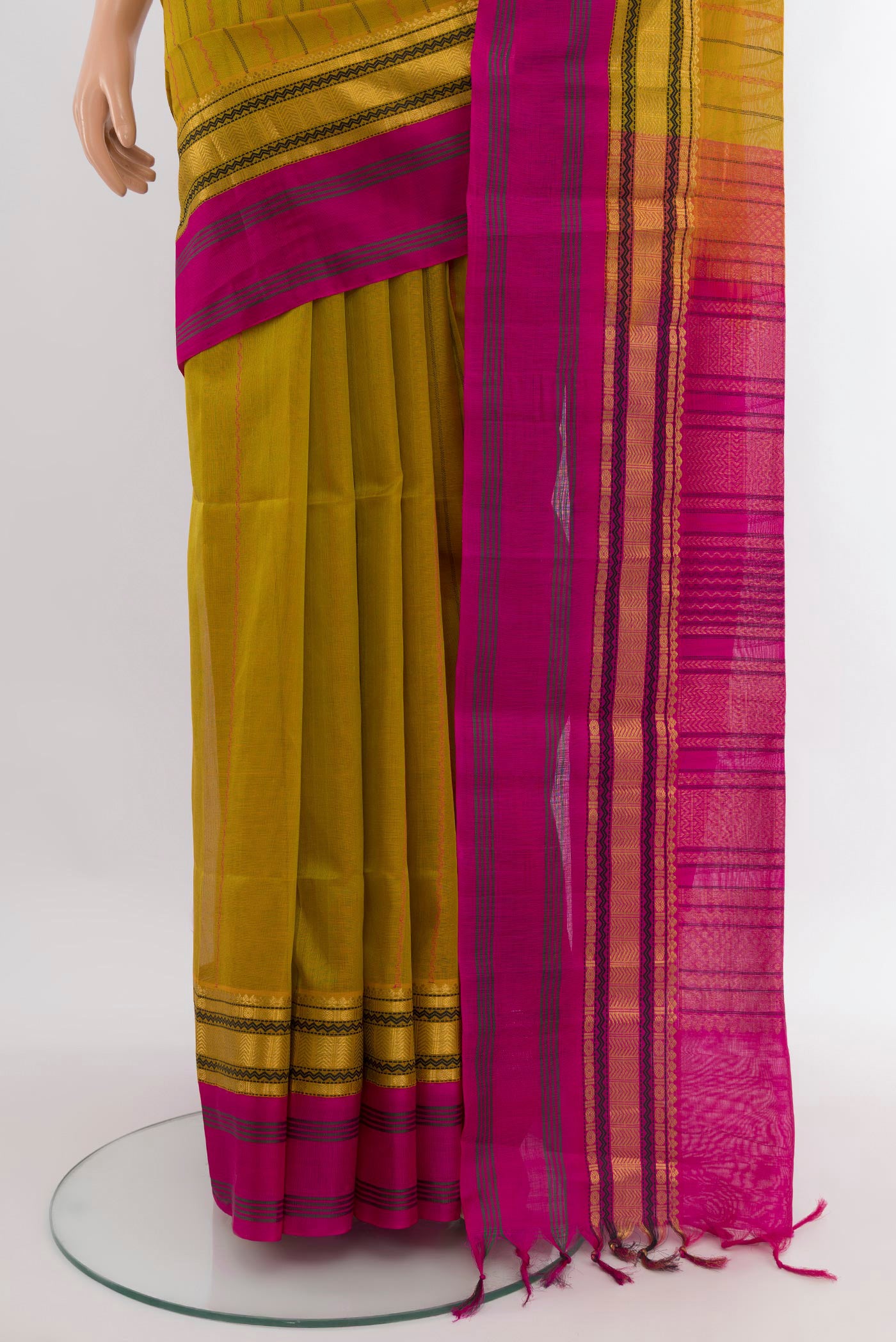 Pleats and pallu of Mehandi Green Silk Cotton Saree with Stripes on the body and Zari Border. 