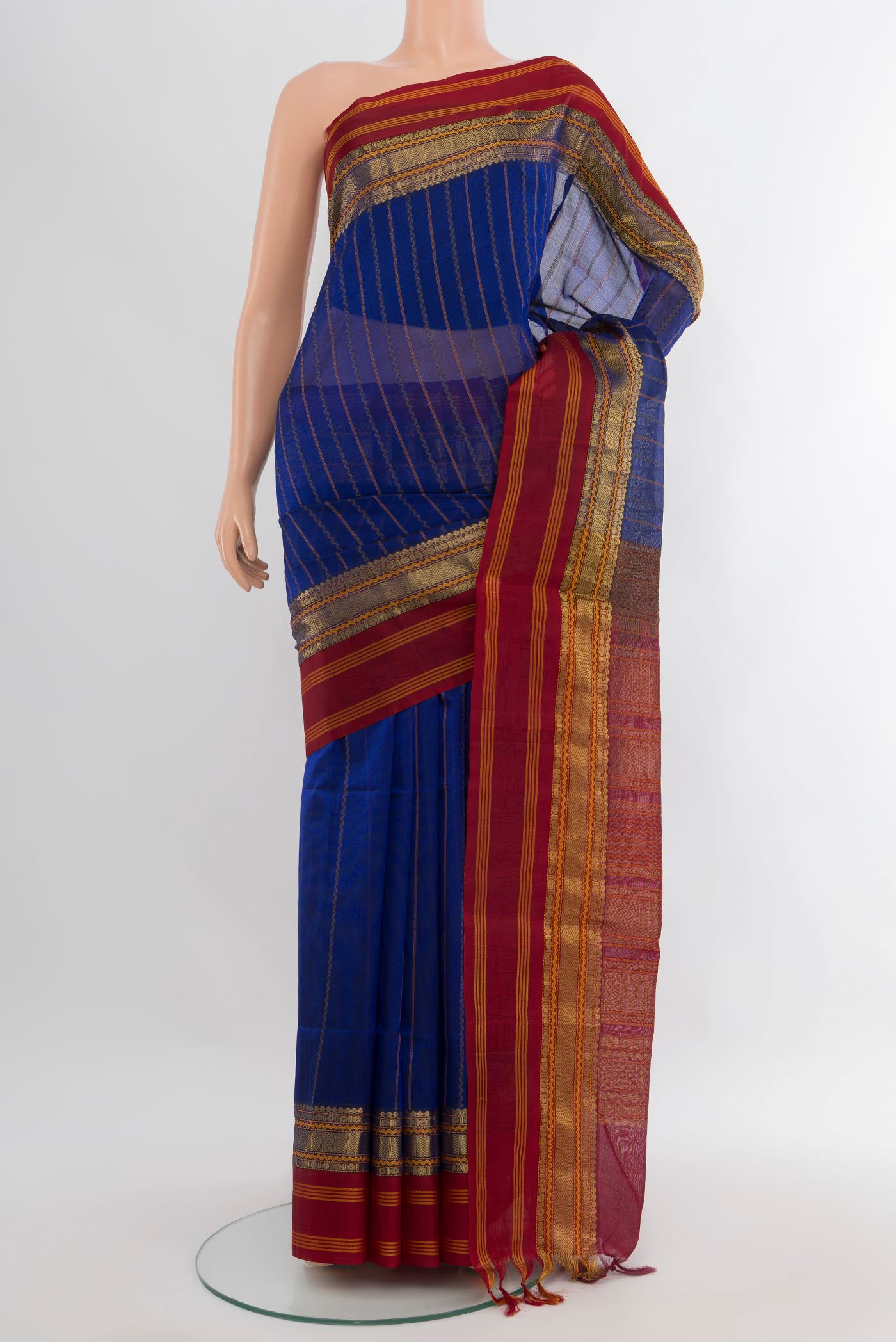 Royal Blue Silk Cotton Saree with Stripes on the body and Zari Border.  displayed on a mannequin