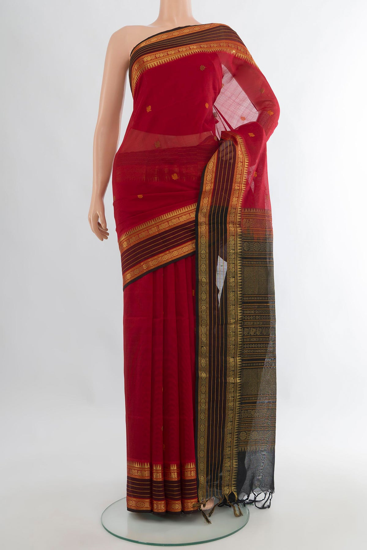 Red Silk Cotton Saree with Zari Butta on the body and Zari Border.  displayed on a mannequin